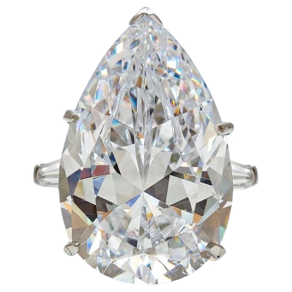 Contemporary GIA Certified 8 Carat Pear Cut Diamond Ring with tapered baguette For Sale