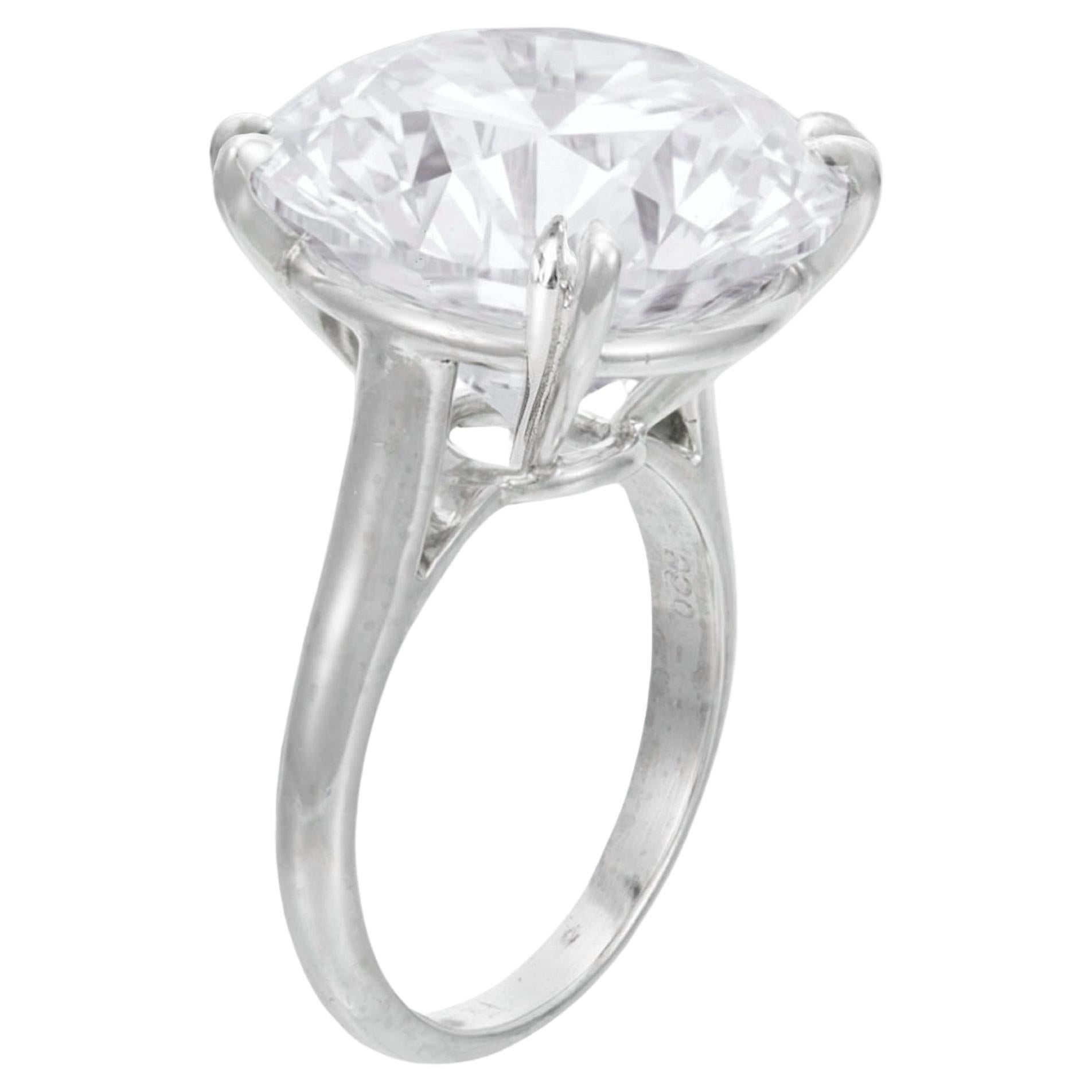This magnificent engagement ring showcases an exceptional 8.07 carat round brilliant cut diamond, set in timeless 18K white gold. 

The diamond, GIA certified, achieves the highest color grade of D, offering an icy, luminous presence that captures