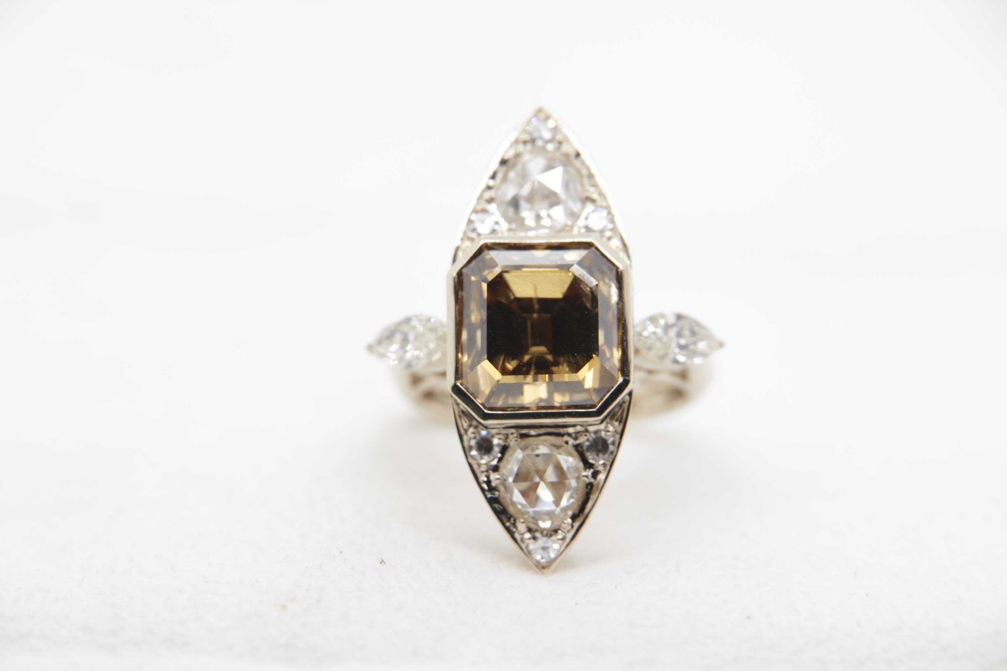 A brand new diamond ring in 18 karat gold. The center diamond one piece weight is 8.00 carat and in addition four pieces are of 1.28 carat and 0.89 carat. The total diamond weight is 10.37 carats and total ring weight is 13.54 grams. The ring is