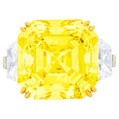 GIA Certified 8.01 Carat Fancy Yellow Diamond Three-Stone Ring