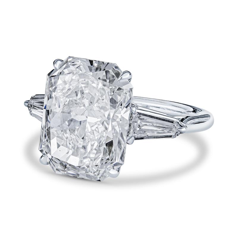 This spectacular engagement ring features an internally flawless, near colorless 8.01 carat radiant cut natural diamond. It is accented by 0.40 carat total weight in two tapered baguette diamonds set in platinum. This is a one in a kind engagement