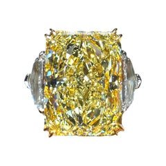 GIA Certified 8.01 Carat Rectangular Radiant Cut Yellow Diamond Three Stone Ring