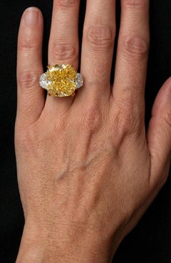 GIA Certified 10 Carat Fancy Intense Yellow Cushion Diamond Three-Stone Ring