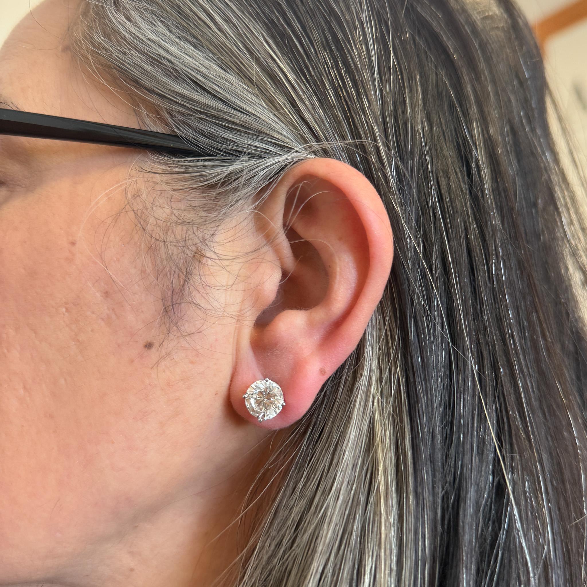 GIA Certified 8 carat total round brilliant cut 9.8mm natural diamond stud earrings. These earrings are close to a matching pair as you will find. These diamonds are the real thing. The stones are eye clean, full of life, and the ideal amount of