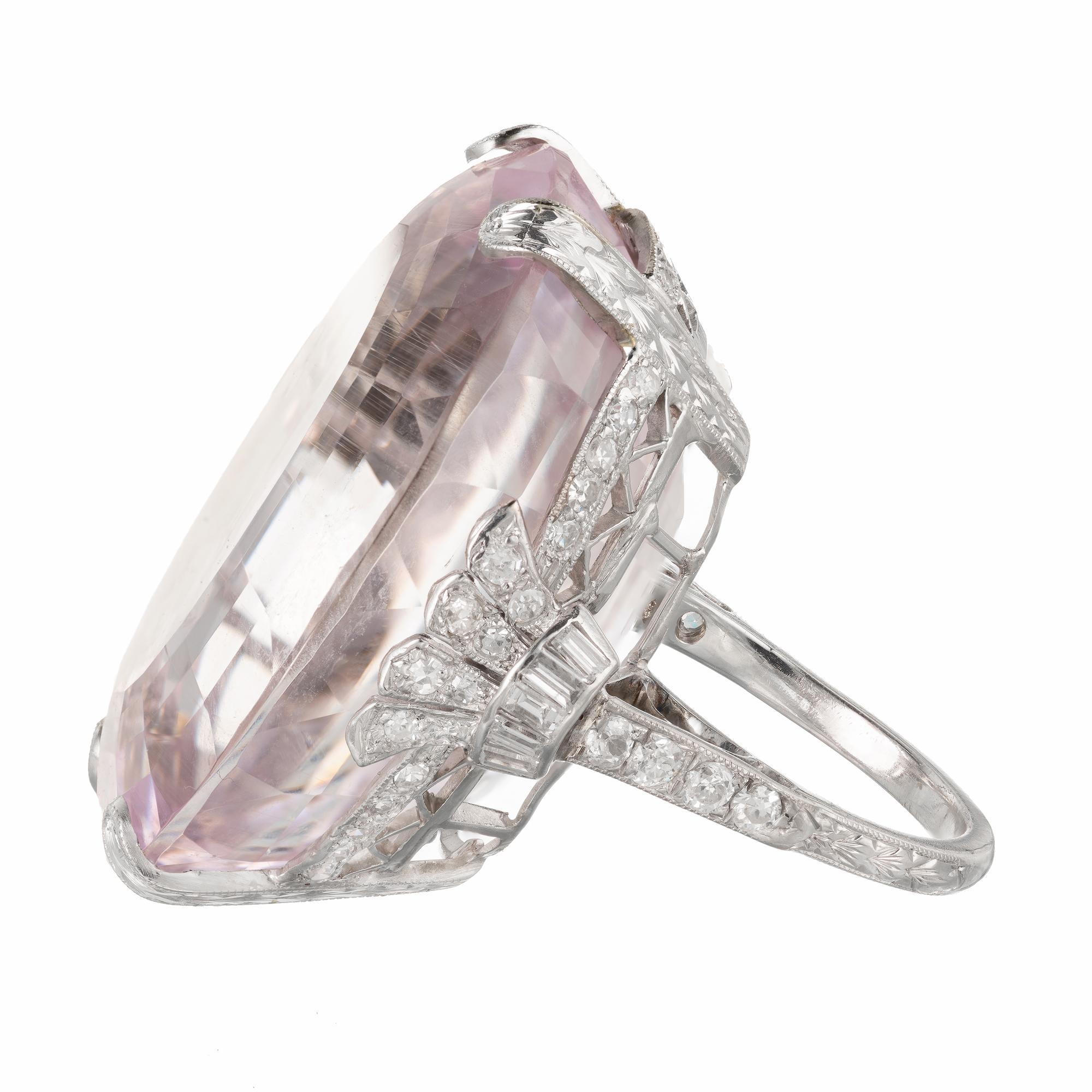 GIA certified bright pink Kunzite 80.25ct Platinum Art Deco ring circa 1915-1920. Handmade and hand engraved. Beautiful workmanship. GIA report determines the stone to be Kunzite. 

1 oval bright pink Kunzite, approx. total weight 80.25cts, GIA