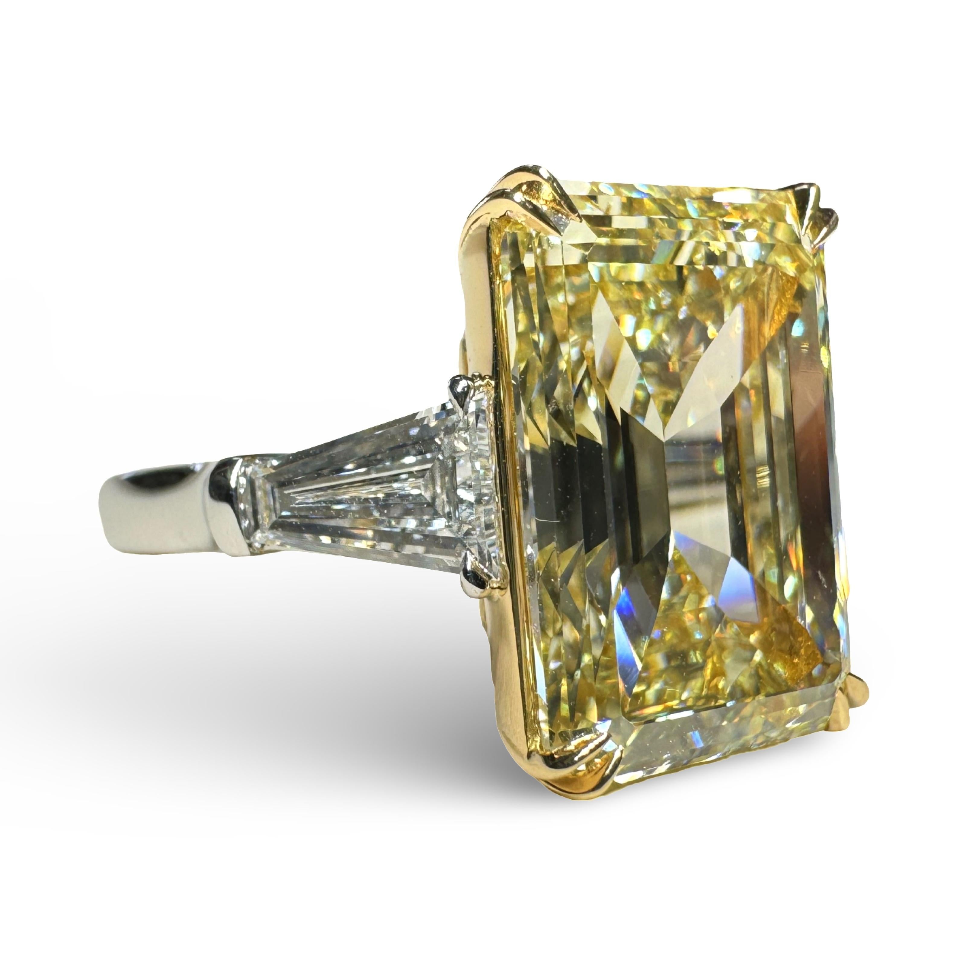 GIA Certified 8.03 Carat Emerald Cut Fancy Yellow Diamond Three Stone Ring In New Condition For Sale In New York, NY