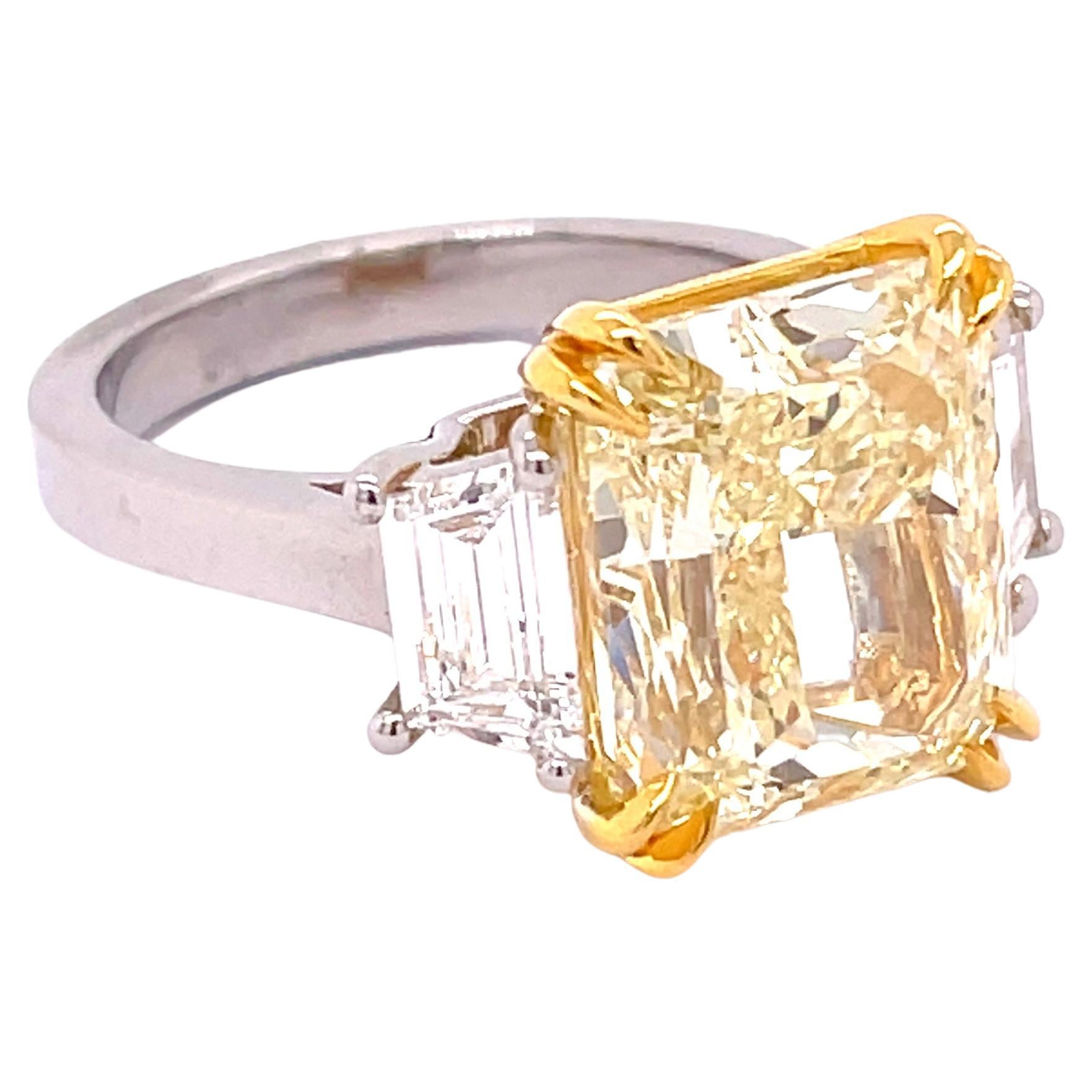 Spectacular GIA Certified 8.03 Fancy Light Yellow Radiant Cut Engagement Ring 

Setting:
Platinum/ 18K Yellow

Center Stone:
11.85 x 9.92 x 6.92 mm 8.03ct Fancy Light Yellow
Cut: Radiant
Clarity: VS1
Polish: Excellent
Symmetry: Excellent

Side