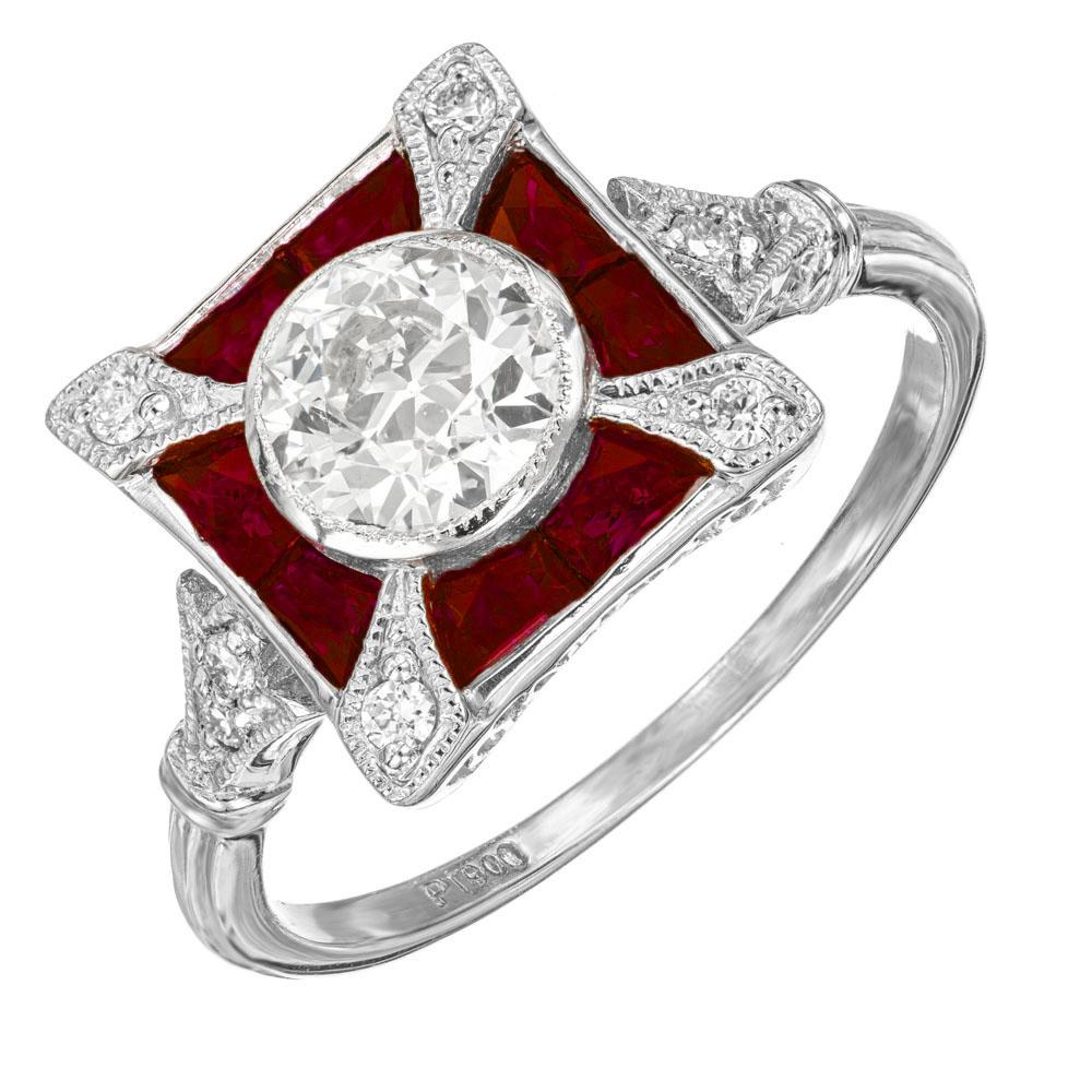 Diamond ruby engagement ring. GIA certified .81 round cut center European Ideal cut diamond, mounted in a Platinum setting with a halo of 8 calibre cut sapphires, accented with 8 round diamonds. Beautiful and dramatic square top Art Deco 1930’s