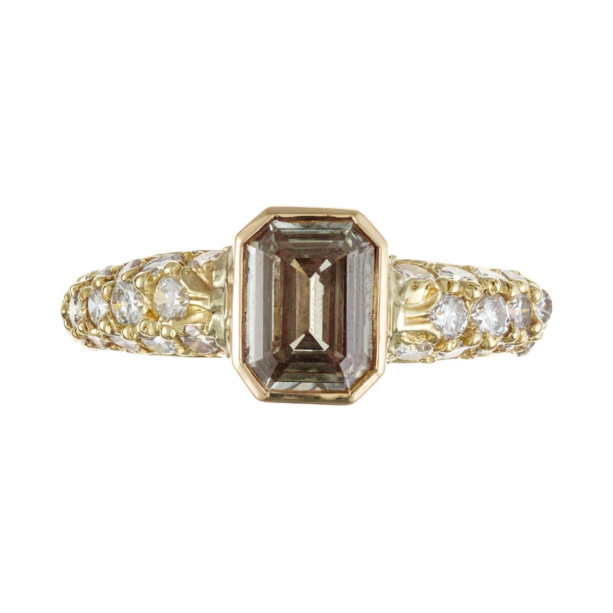Vintage 1950's light brown diamond engagement ring. GIA certified eight sided emerald cut light brown diamond in a 18k yellow gold custom made bezel setting with 28 full cut round accent diamonds. 

1 emerald cut diamond, W-X light yellow VS2