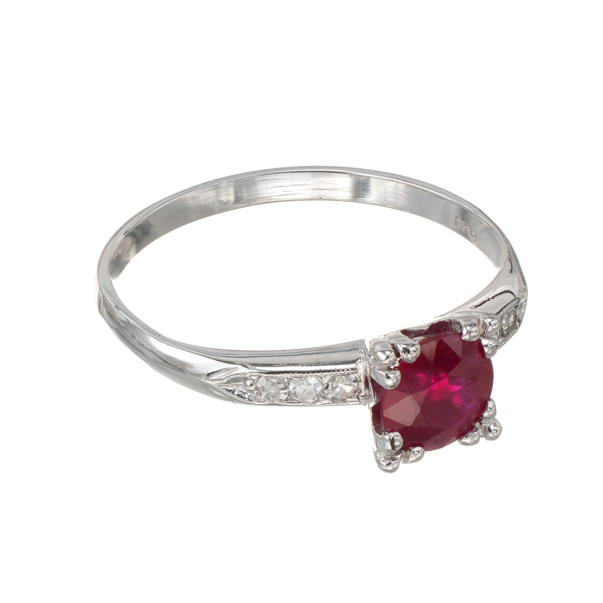 1940's Ruby and diamond handmade fishtail engagement ring. Ruby center stone with 6 round accent diamonds. GIA certified natural ruby, heated with moderate residue, natural wear, minor surface abrasions. 

1 round red ruby, approx. .81cts SI GIA