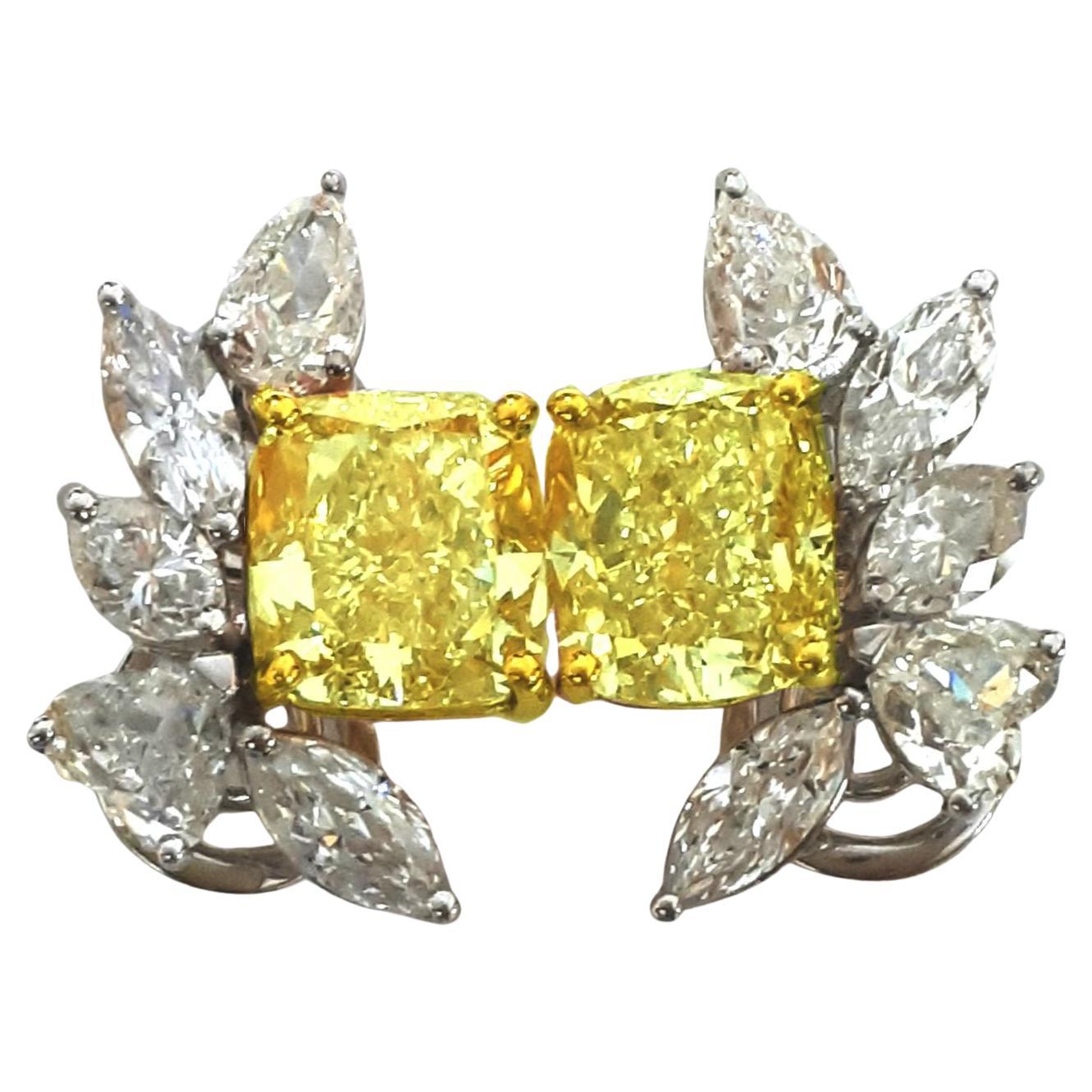 an exquisite diamond piece featuring two stunning cushion diamonds, weighing 4.03 carats and 4.07 carats, respectively. Both cushion diamonds are graded by GIA, showcasing a beautiful U-V color range and a clarity rating of VVS1, ensuring their