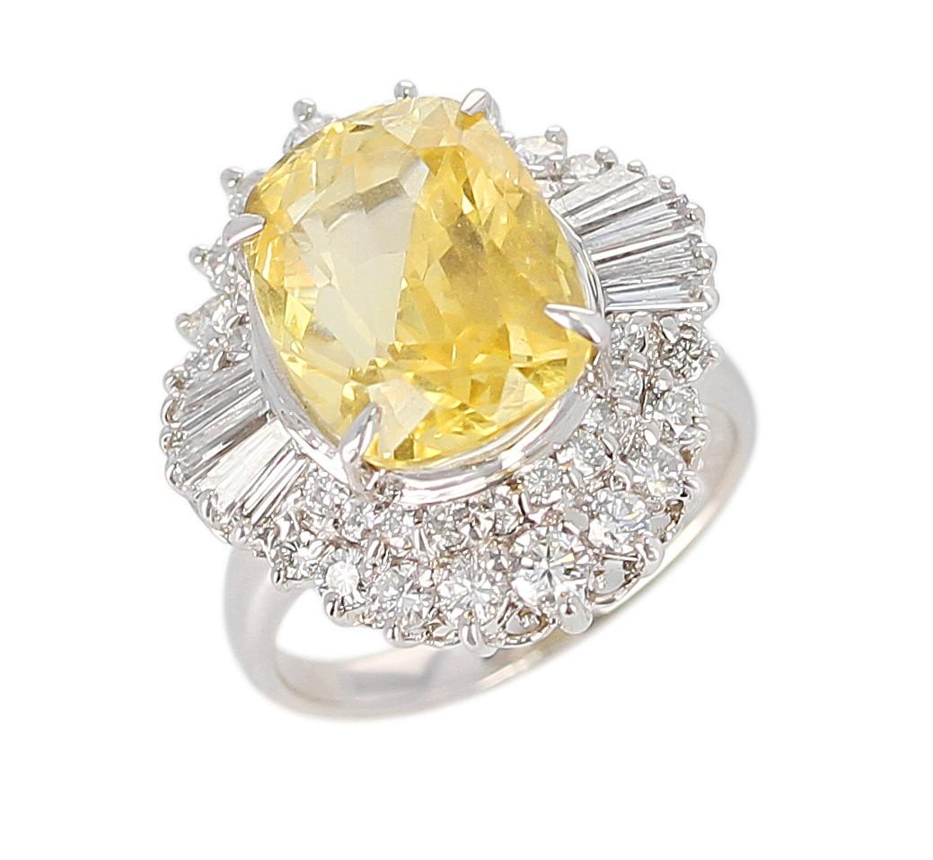 A 8.18 ct. Oval No Heat Ceylon Yellow Sapphire Cocktail Ring with Diamonds made in Platinum. Diamonds Weigh: 1.42 carats, Total Weight: 12.20 grams. Ring Size US 6.25.  GIA Certificate Available. 