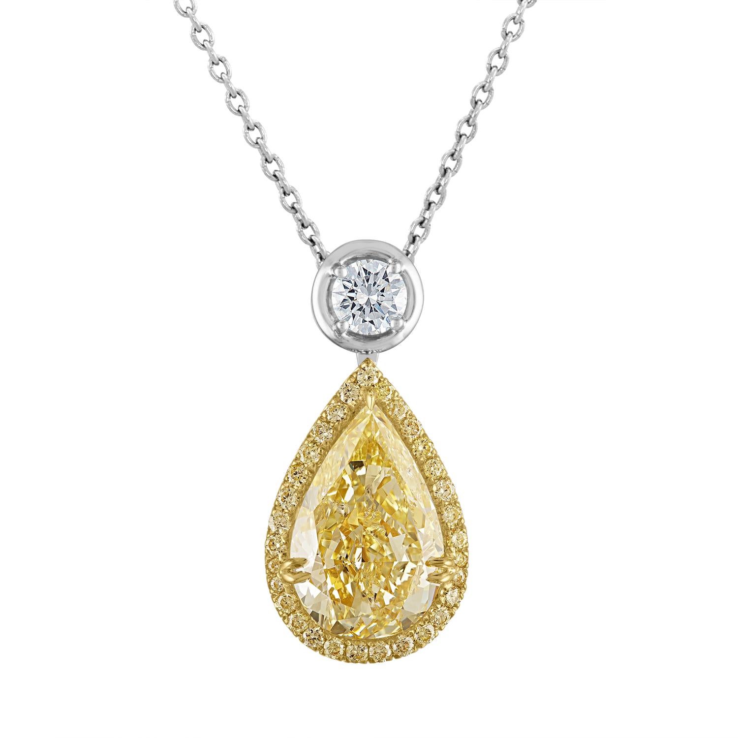 Brilliant Pear Shape, GIA Certified as Fancy Light Yellow in Color and SI2 in Clarity is set in Two Tone Mounting, 18K Yellow Gold and Platinum.
The 8.19 Carat Pear Shape is set in 18K Yellow Gold Box Surrounded by Yellow Diamonds, 31 Round