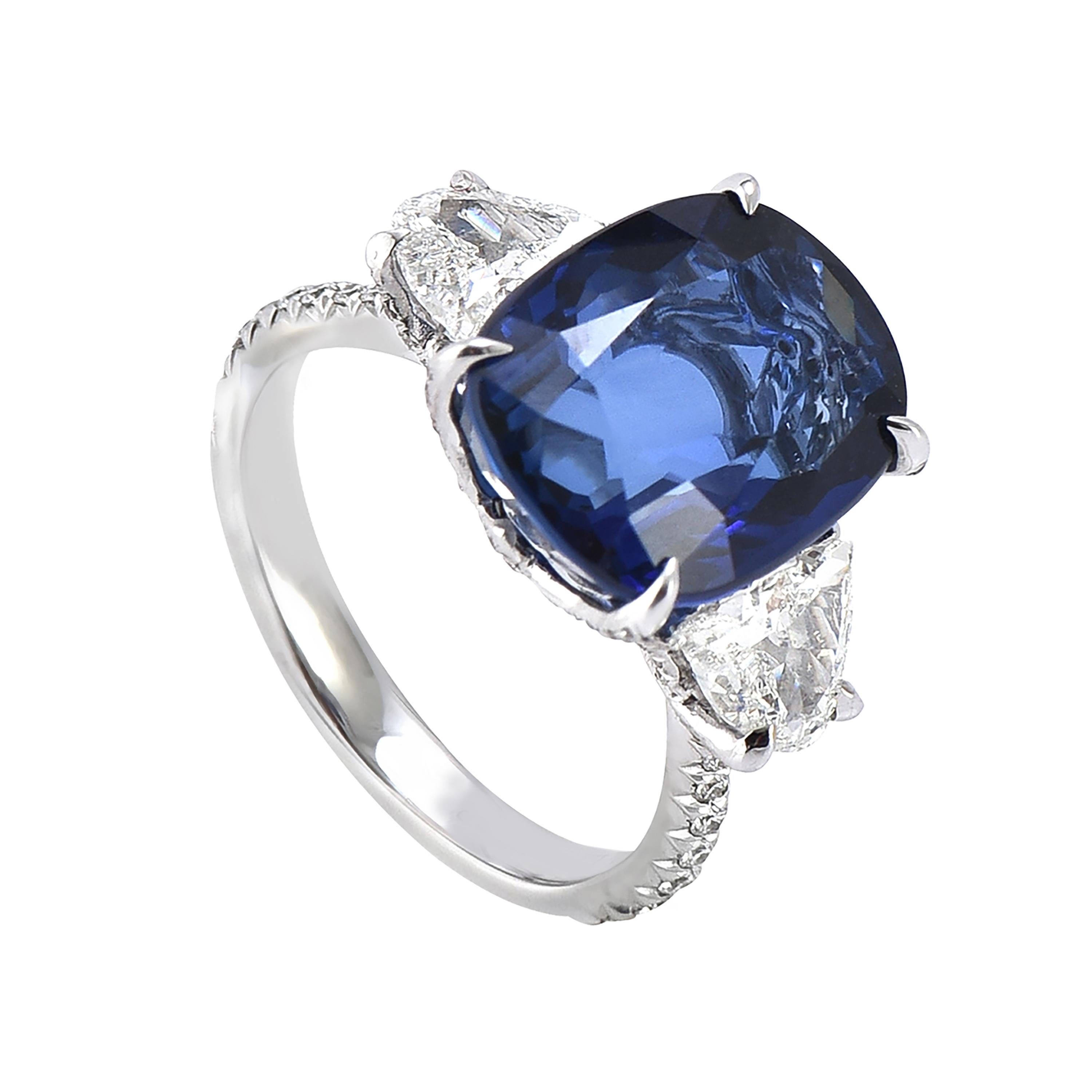 18 karat white gold blue sapphire ring from the Azure collection of Laviere. The ring is set with a GIA certified Sri Lankan 8.20 carats cushion-cut blue sapphire in the center, one carat half moon cut diamonds and 0.42 carats round brilliant