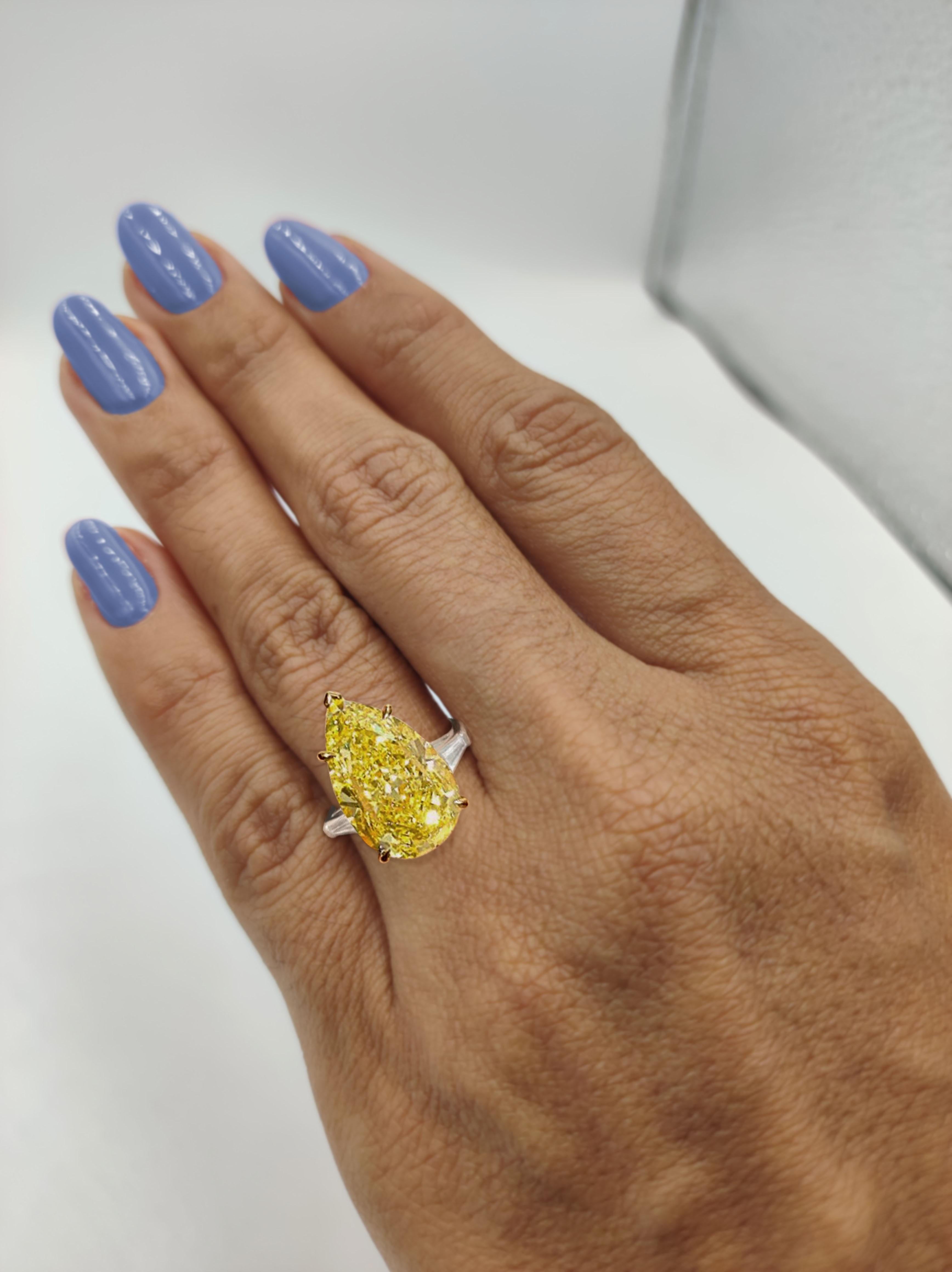 Stunning fancy intense yellow diamond (looks fancy vivid in the ring) with white diamond double halo basket, GIA certified. High jewelry by Antinori di Sanpietro ROMA
8.25 carats total diamond weight.
0.80 carat tapered shape diamond, Fancy intense