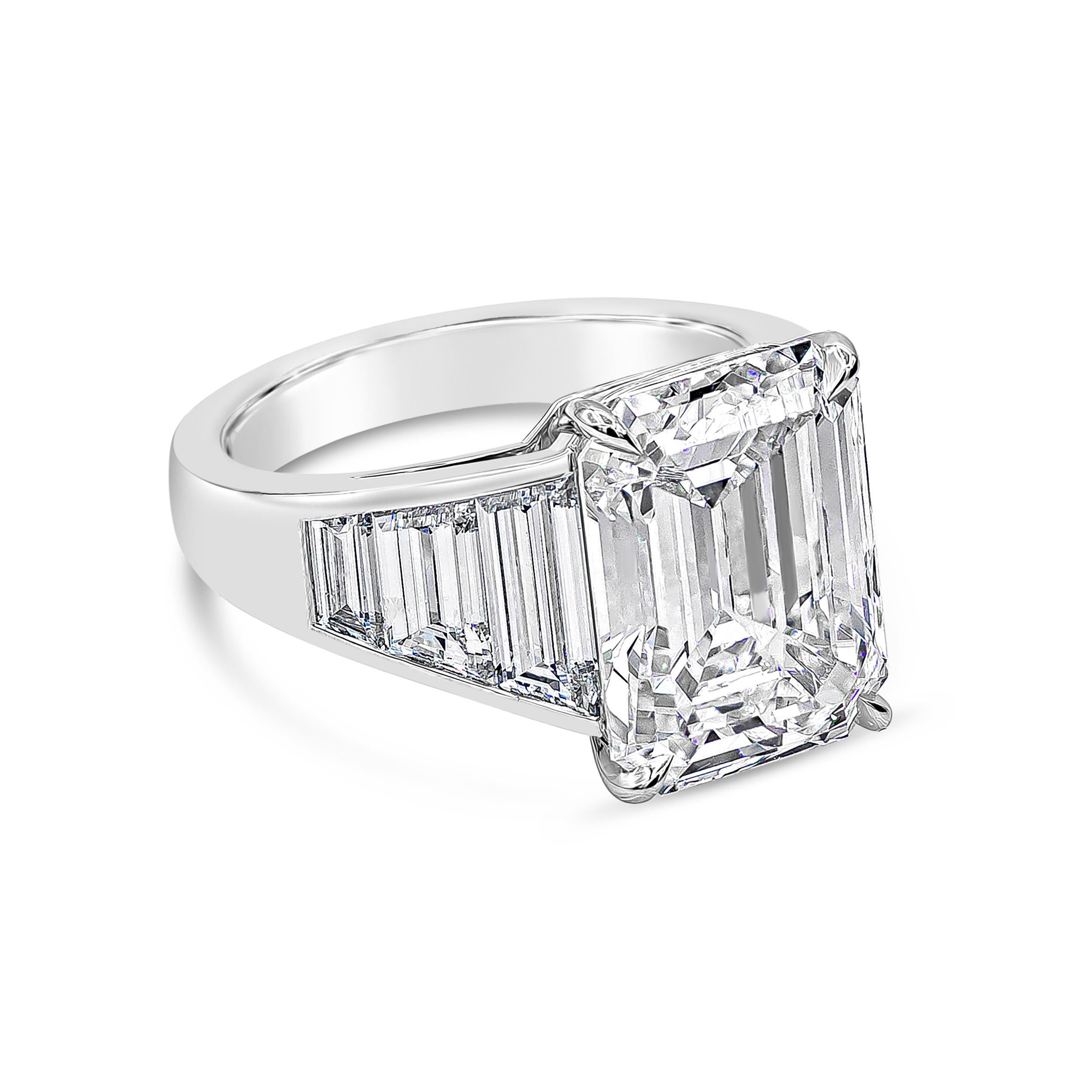 A stunning well-crafted engagement ring showcasing 8.35 carats emerald cut diamond certified by GIA as H color and VVS2 in clarity. Flanking the center diamond are perfectly matched graduating trapezoid diamonds weighing 2.81 carats total. Channel