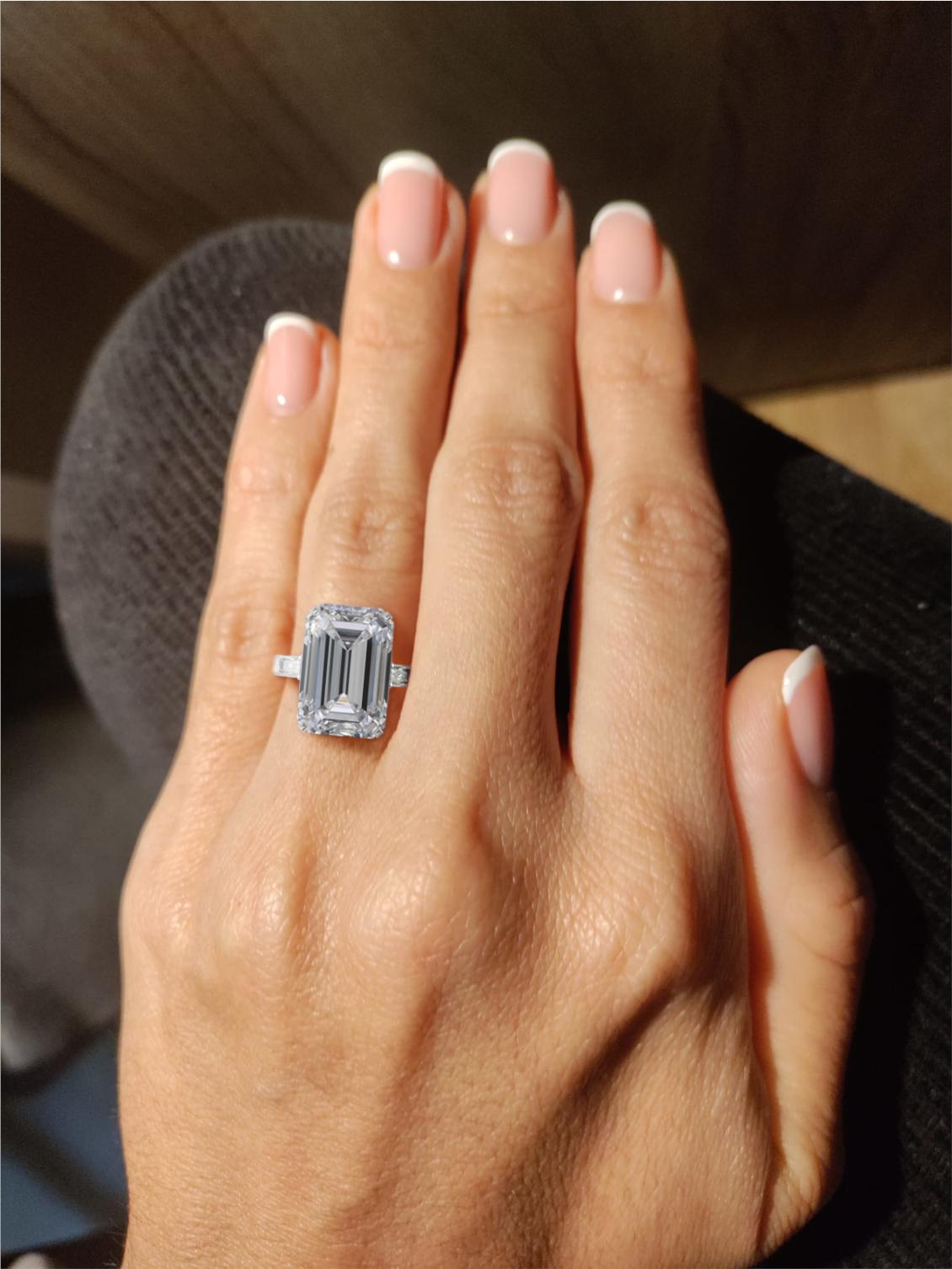 An exquisite 5.30 Emerlald cut diamond ring. The main stone is an incredible 5.30 carat emerald cut diamond flawless clarity d color and excellent polish and excellent symmetry none fluorescence 
type IIA investment grade diamond

This diamond has a