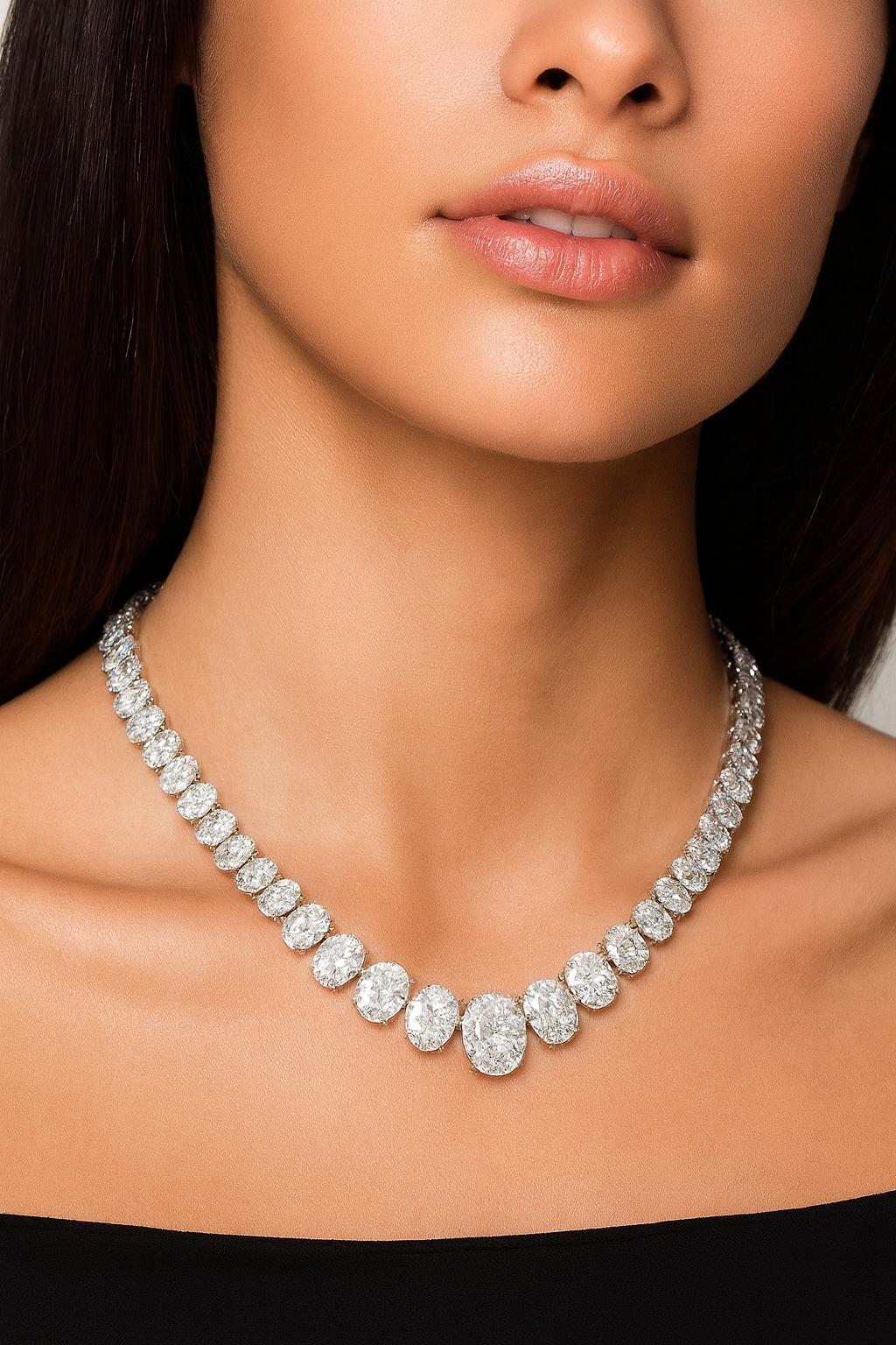 GIA Certified 85.10 Carat Oval Brilliant Cut Diamond Riviera Necklace

An extraordinary Riviera tennis necklace showcasing 85.10 carats of natural oval brilliant cut diamonds, meticulously hand-set into a graceful 16-inch line design. Weighing 57.2