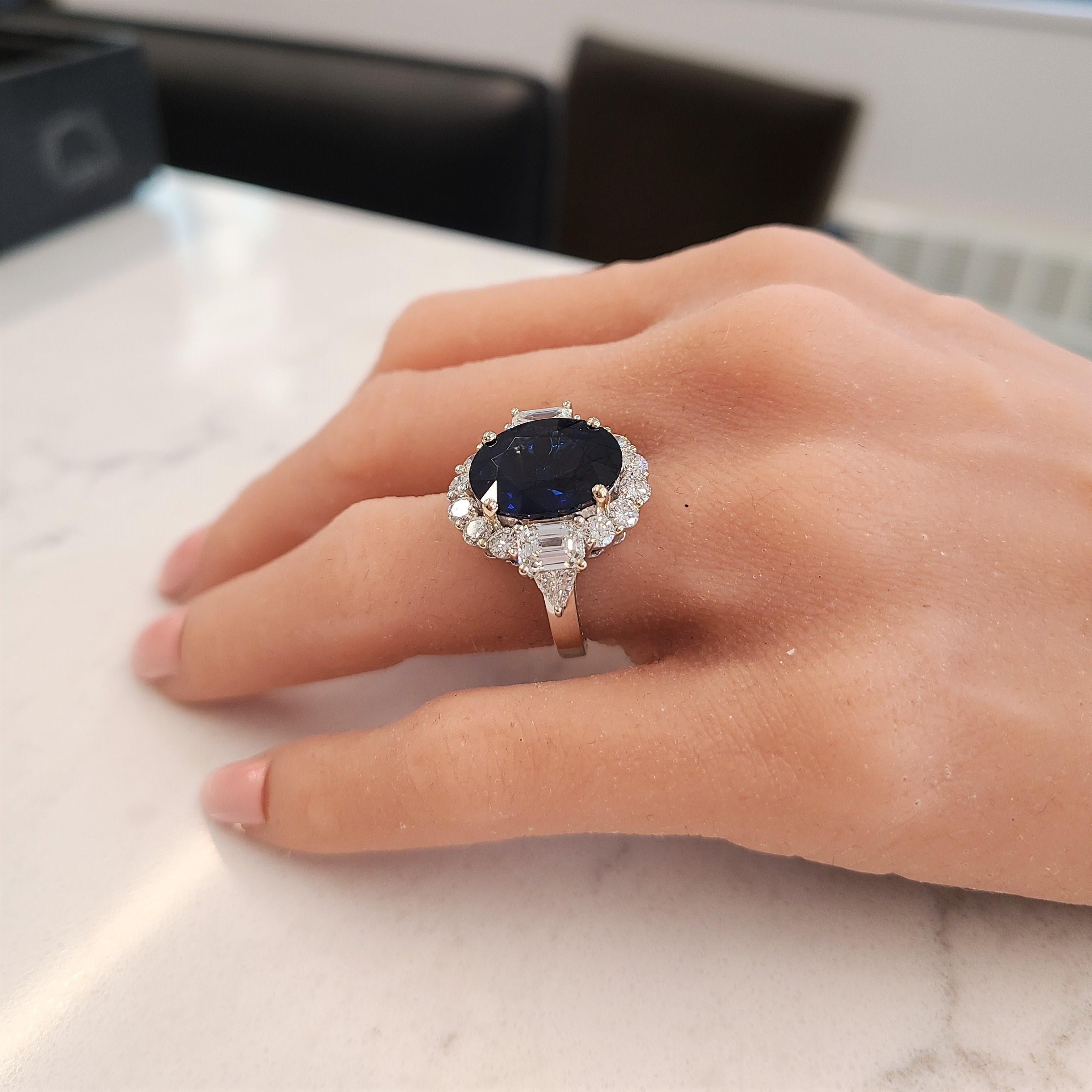 This is an example of what premiere craftsmanship with high-quality precious gemstones and diamonds really is. A GIA certified 8.74 carat blue sapphire takes center stage in a prong setting measuring 14.85-11.47mm. Its gem source is Sri Lanka; its