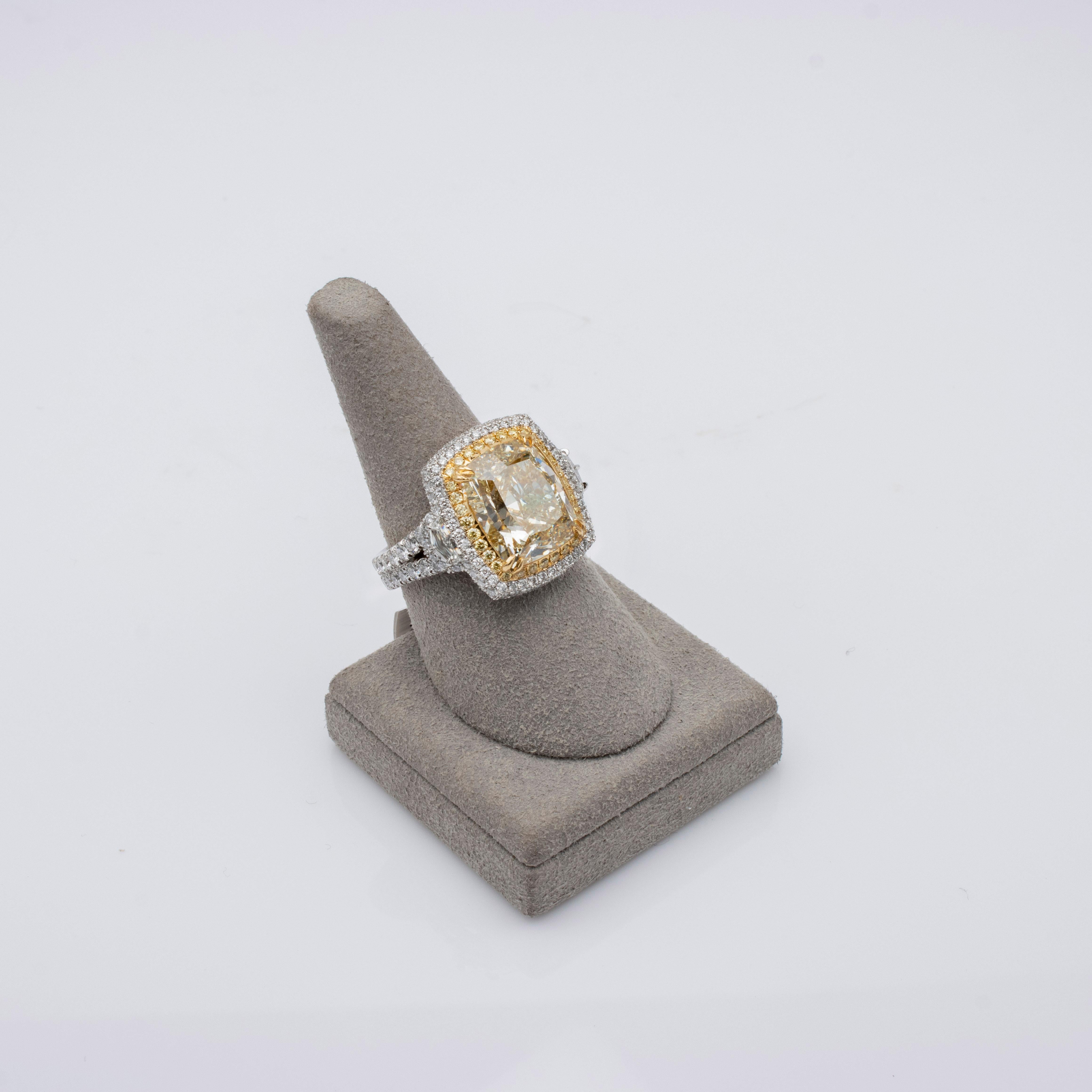 Women's GIA Certified 8.77 Carat Light Yellow Diamond Three-Stone Halo Engagement Ring For Sale