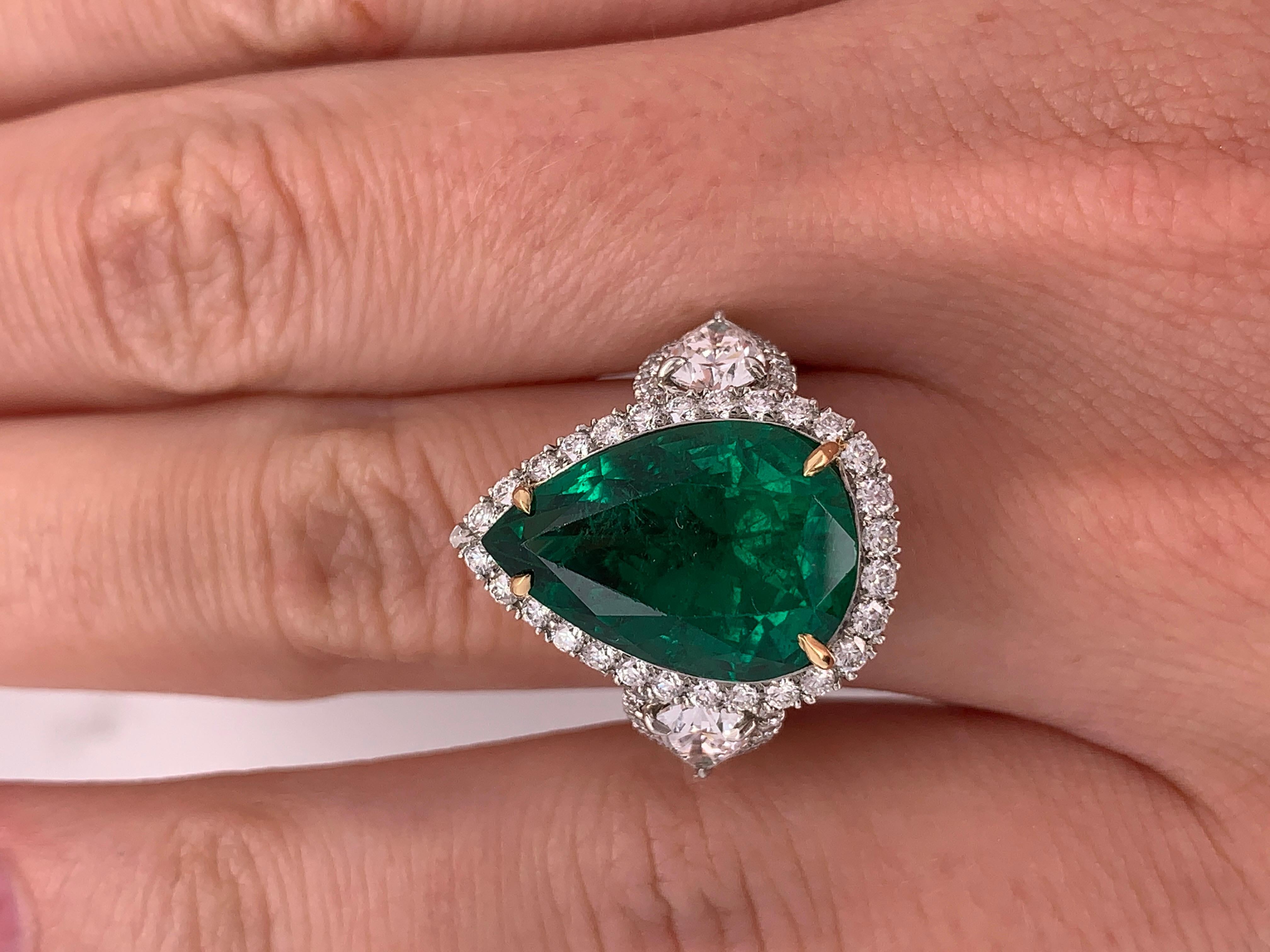 Emerald Cut GIA Certified 8.78 Carat Green Emerald Pear Shaped Platinum Ring with Diamonds For Sale