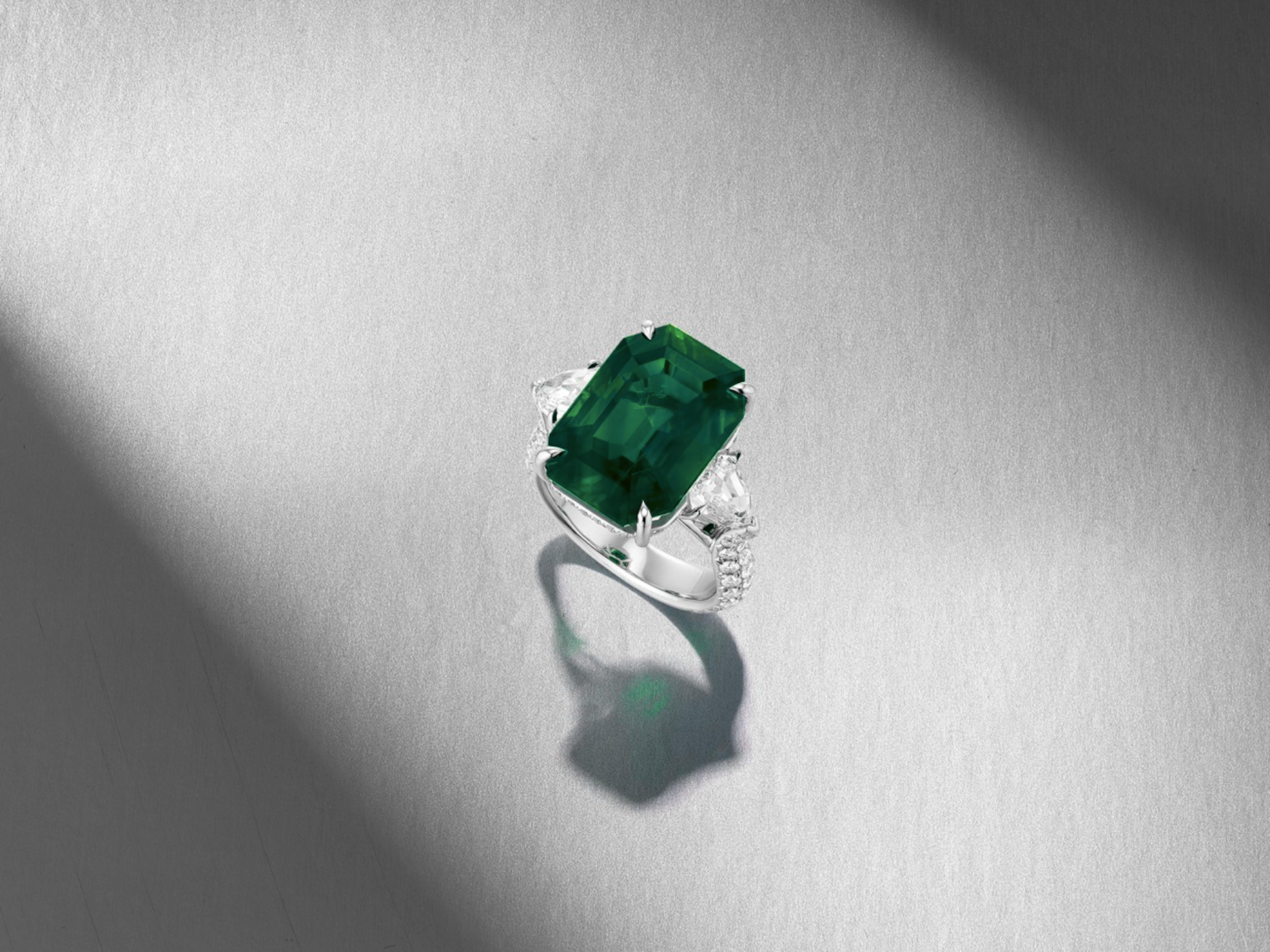  GIA Certified 8.84 Carat NO OIL Investment Grade Green Emerald Diamond Ring! This exquisite piece features a stunning emerald center stone, elegantly flanked by two shield-shaped diamonds, and enhanced by a brilliant-cut diamond gallery and