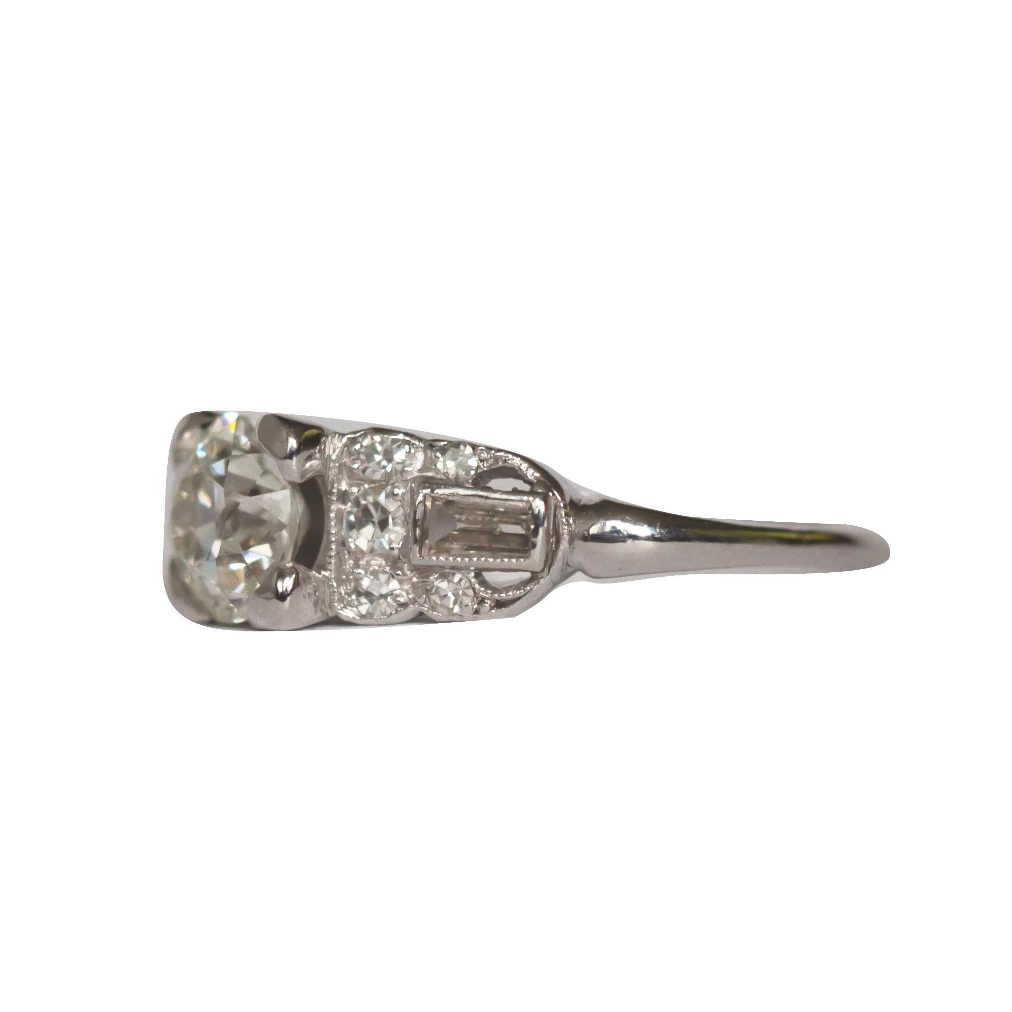 Ring Size: 6.25
Metal Type: Platinum [Hallmarked, and Tested]
Weight:  3.9 grams

Center Diamond Details:
GIA REPORT#2215013608
Weight: .89 carat
Cut: Old European Brilliant
Color: I 
Clarity: VS1

Side Diamond Details:
Weight: .25 carat, total