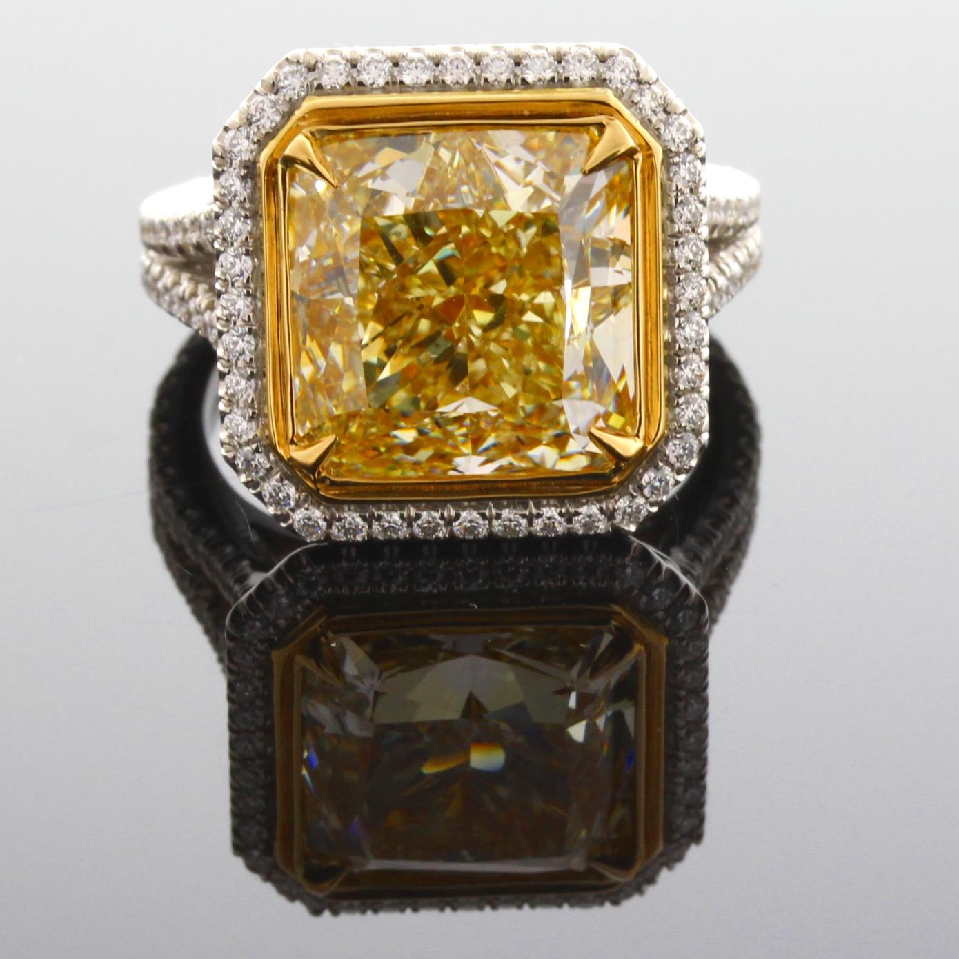 Incredible Deal on GIA Certified 8.93 carat Radiant Cut, Natural Fancy Yellow Even Diamond Ring,  VS2  Clarity, measuring 11.02-10.87x7.69.  Total Carat weight on the ring is 9.57. 
GIA Certificate #2191057650
This classic contemporary mounting was