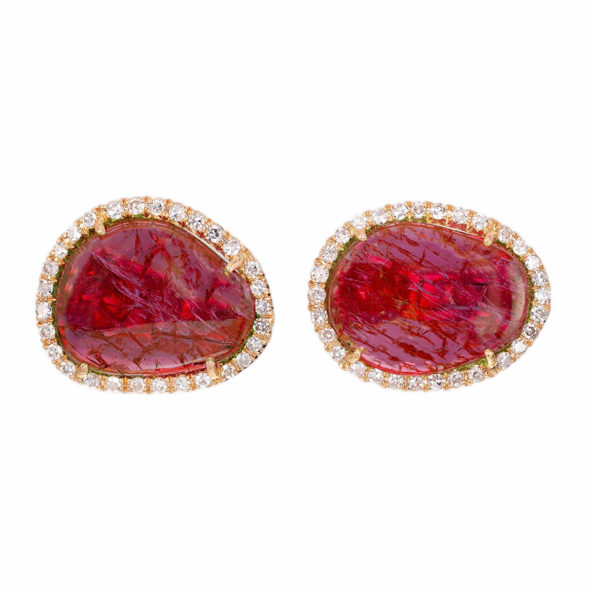 Natural untreated purplish pink sapphire slice and diamond earrings. Set in 18k yellow gold with round diamond halos. Clip and post style. GIA certified.

2 free form purplish pink cabochon sapphires MI, approx. 9.00cts GIA certificate