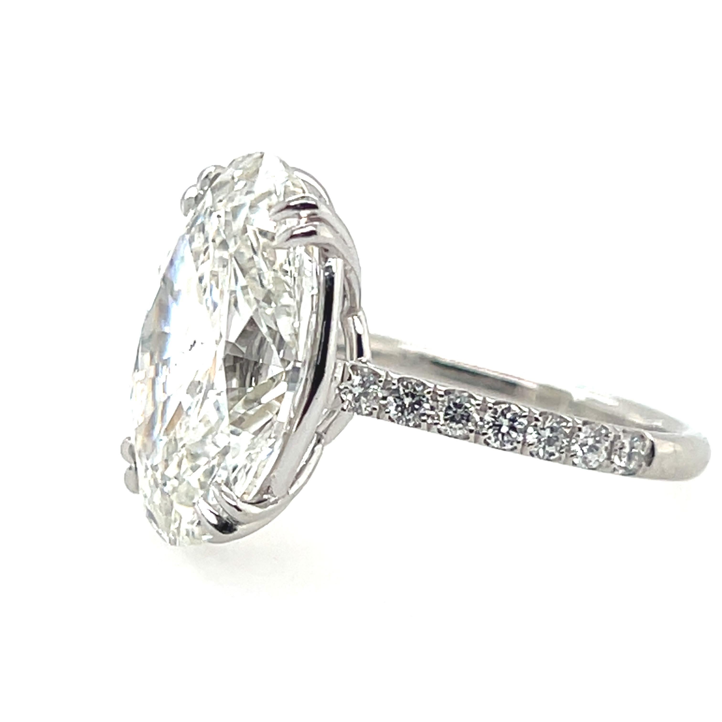 A Magnificent 9.01 carat Natural GIA Certified Diamond Engagement Ring. 

The center stone is laser inscribed (GIA #7346100629) with ideal proportions, measuring 17.06x11.52x7.32mm. The color is graded as a G and the clarity is an SI1. Polish and