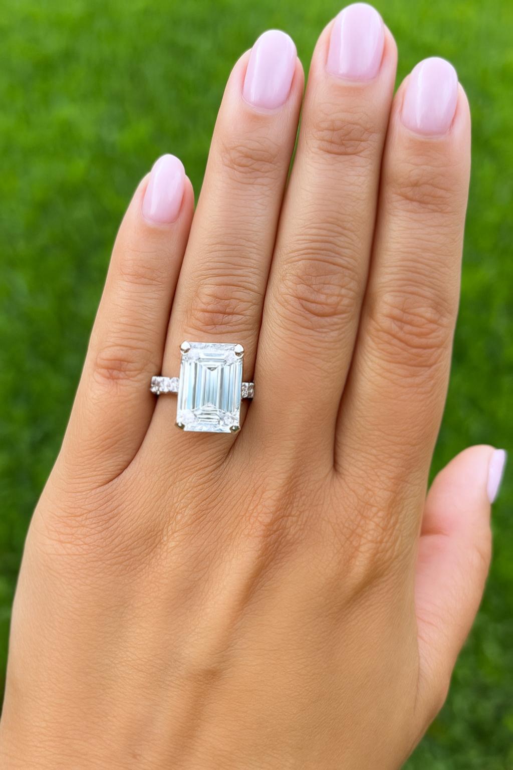 An extraordinary piece of high jewelry, this ring showcases a breathtaking 9.05 carat emerald cut diamond, certified by GIA as D color, Flawless clarity, with Excellent polish and symmetry—an ultra-rare combination that represents the very highest