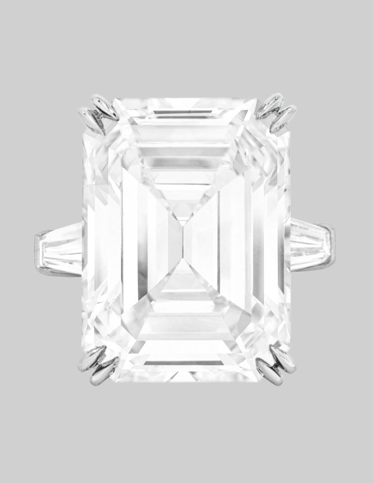 Any emerald-cut lover will fall for this nearly nine carat diamond classic engagement ring with its ideal platinum proportions, mirrored depths, and broad flashes of white light. The emerald-cut diamond was the result of increasing precision and