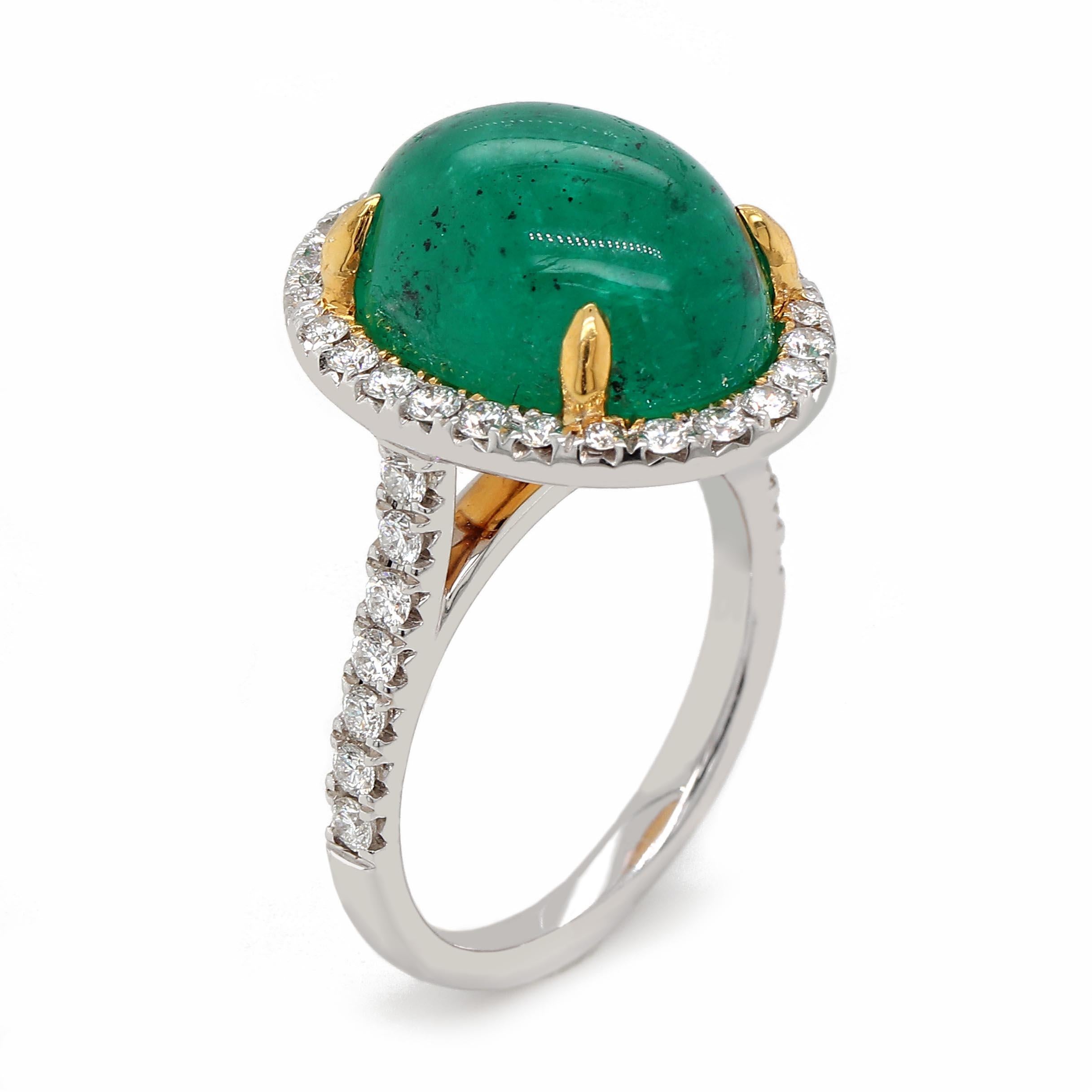 GIA certified oval cabochon emerald of about 9.17 carats surrounded by 40 round brilliant cut diamonds of about 0.70 carats with a clarity of VS and color G. All set in a 18k two tone ring. Total weight of the ring is approximately 8.82 grams.

GIA