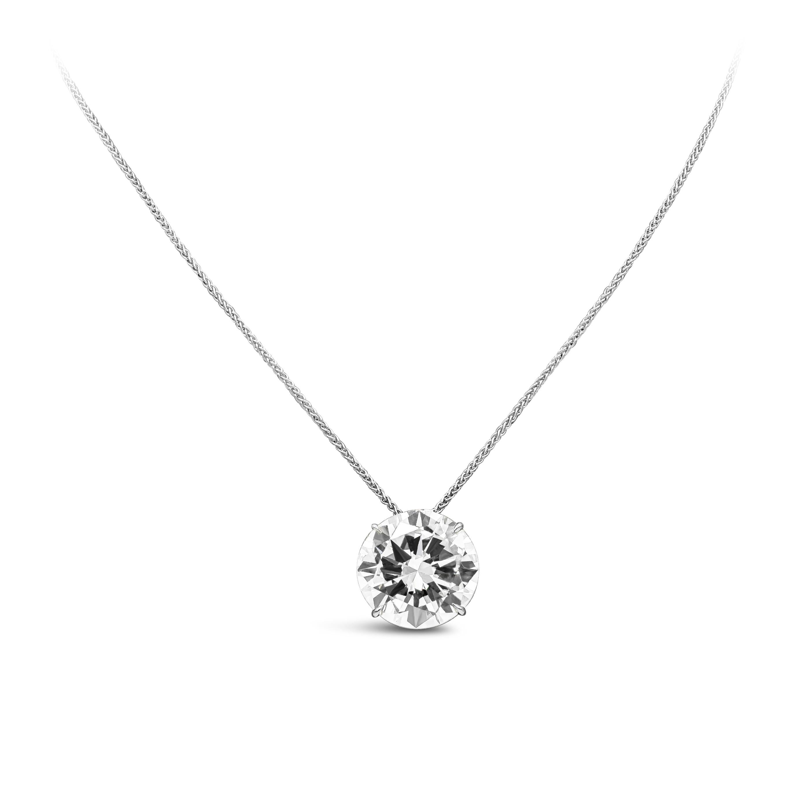 A bold and classy pendant necklace showcasing a luxurious 9.17 carats brilliant round diamond certified by GIA as S-T color, VVS2 in clarity. Set in a four prong basket setting and made in platinum. Suspended on an 18 inch spiga / wheat chain made