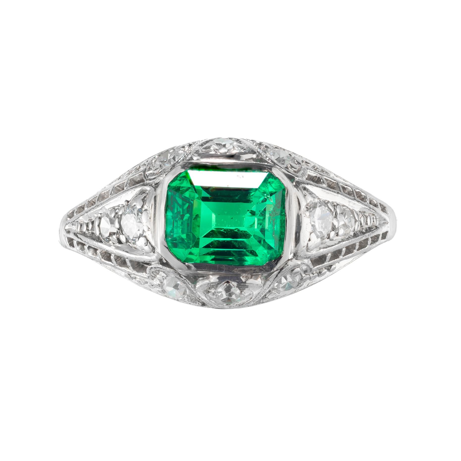 Ultra-bright emerald cut emerald and diamond engagement ring. GIA certified Colombian emerald center stone set in a handmade Art Deco filigree setting with ten sing cut accent diamonds. Circa 1930's 

1 octagonal bright green emerald, approx. .92cts
