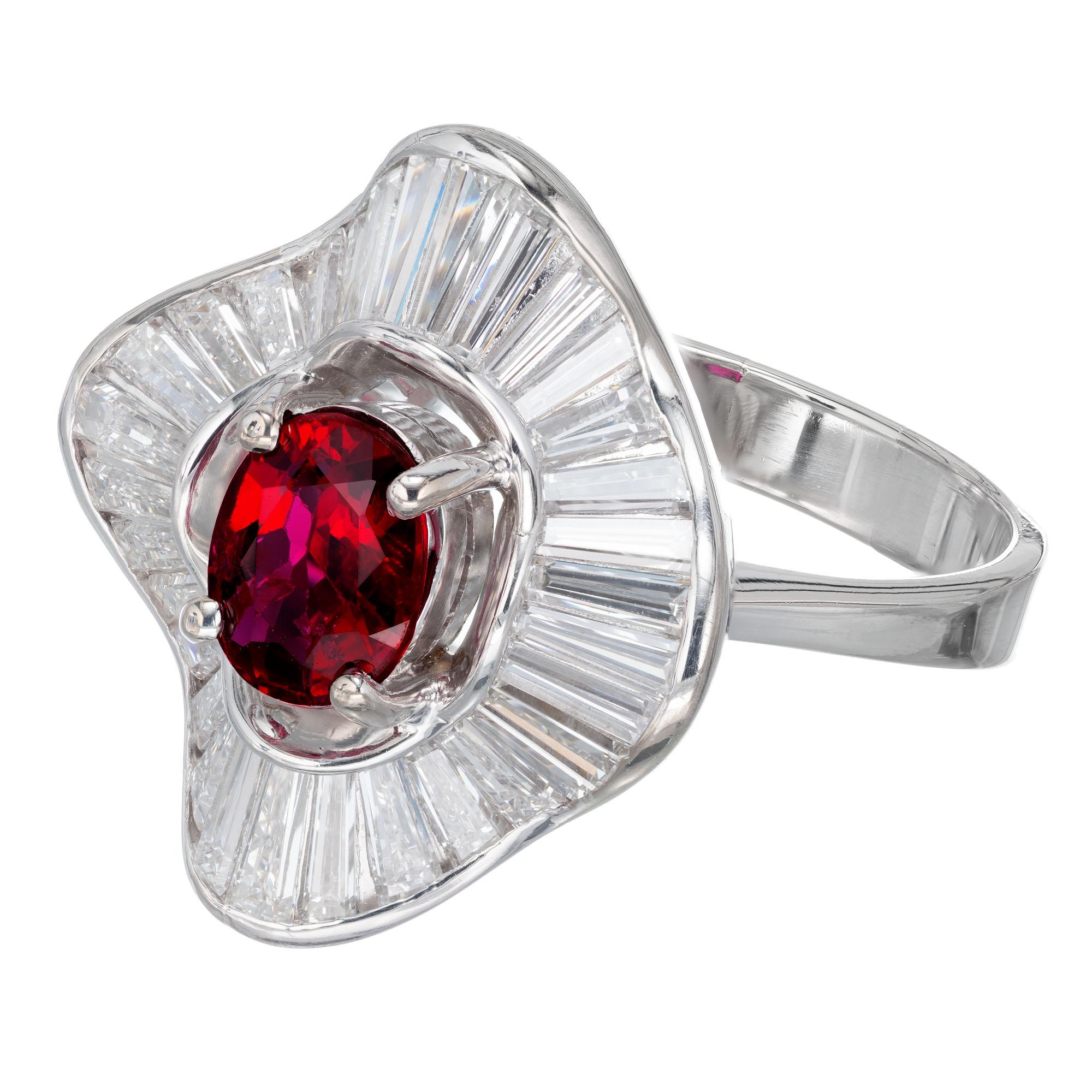 GIA certified Ruby and diamond ballerina cocktail ring. Oval center ruby with a halo of 32 tapered baguette diamonds, in a 14k white gold ballerina setting. GIA Certified natural conundrum ruby simple heat only. 

1 oval red ruby, approx. .92ct GIA