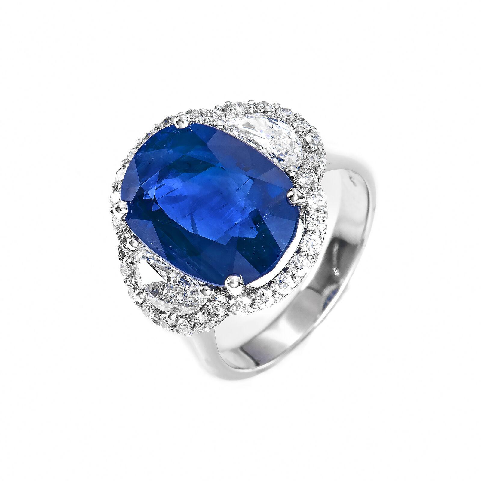 Gorgeous one of a kind designer GIA certified natural Gem quality  royal blue color sapphire and diamond ring. This gorgeous piece is made with a center stone being an 7.71 carat natural Ceylon blue sapphire and two half moon diamonds surrounded by