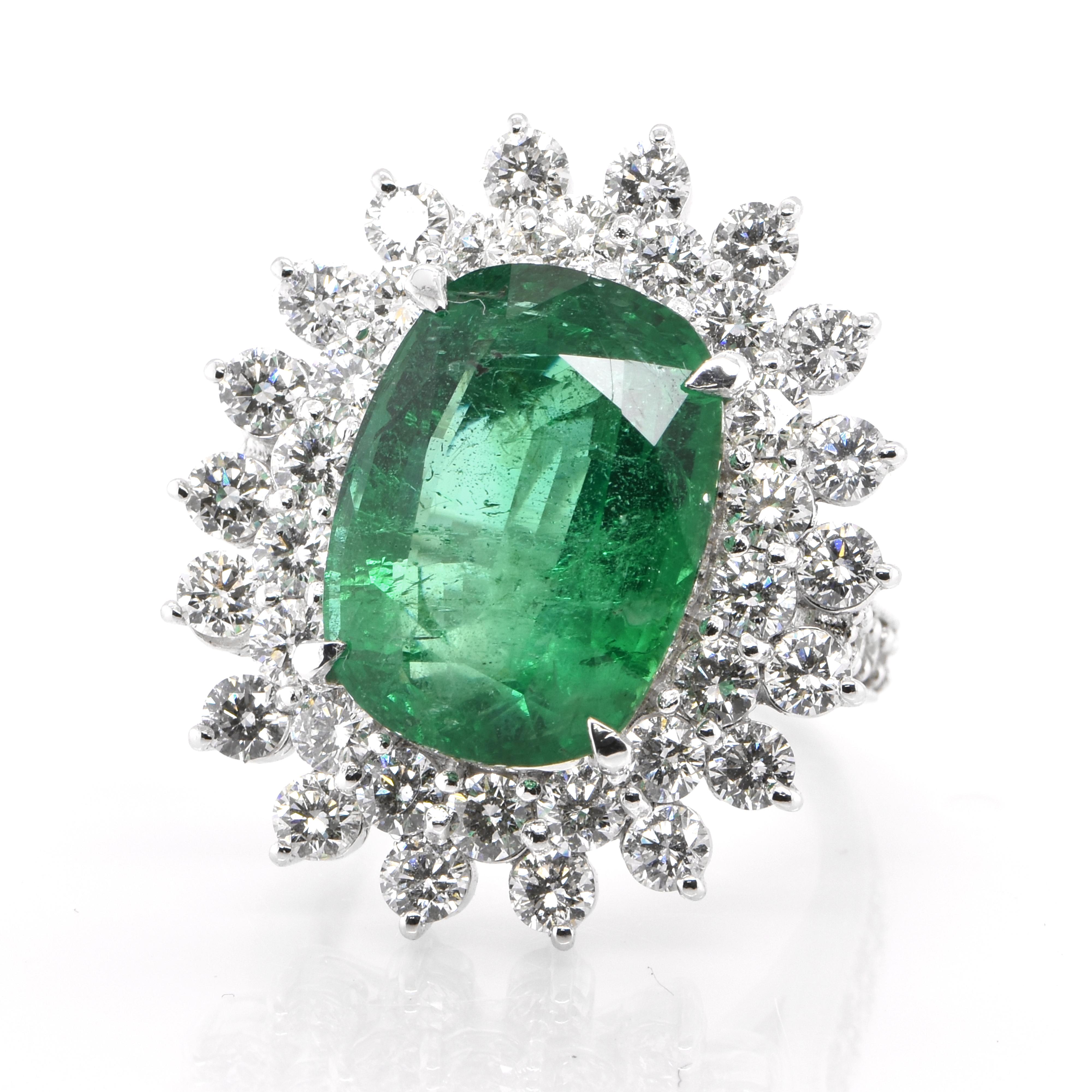 A stunning double halo cocktail ring featuring a 9.37 Carat Natural Emerald and 3.20 Carats of Diamond Accents set in Platinum. People have admired emerald’s green for thousands of years. Emeralds have always been associated with the lushest