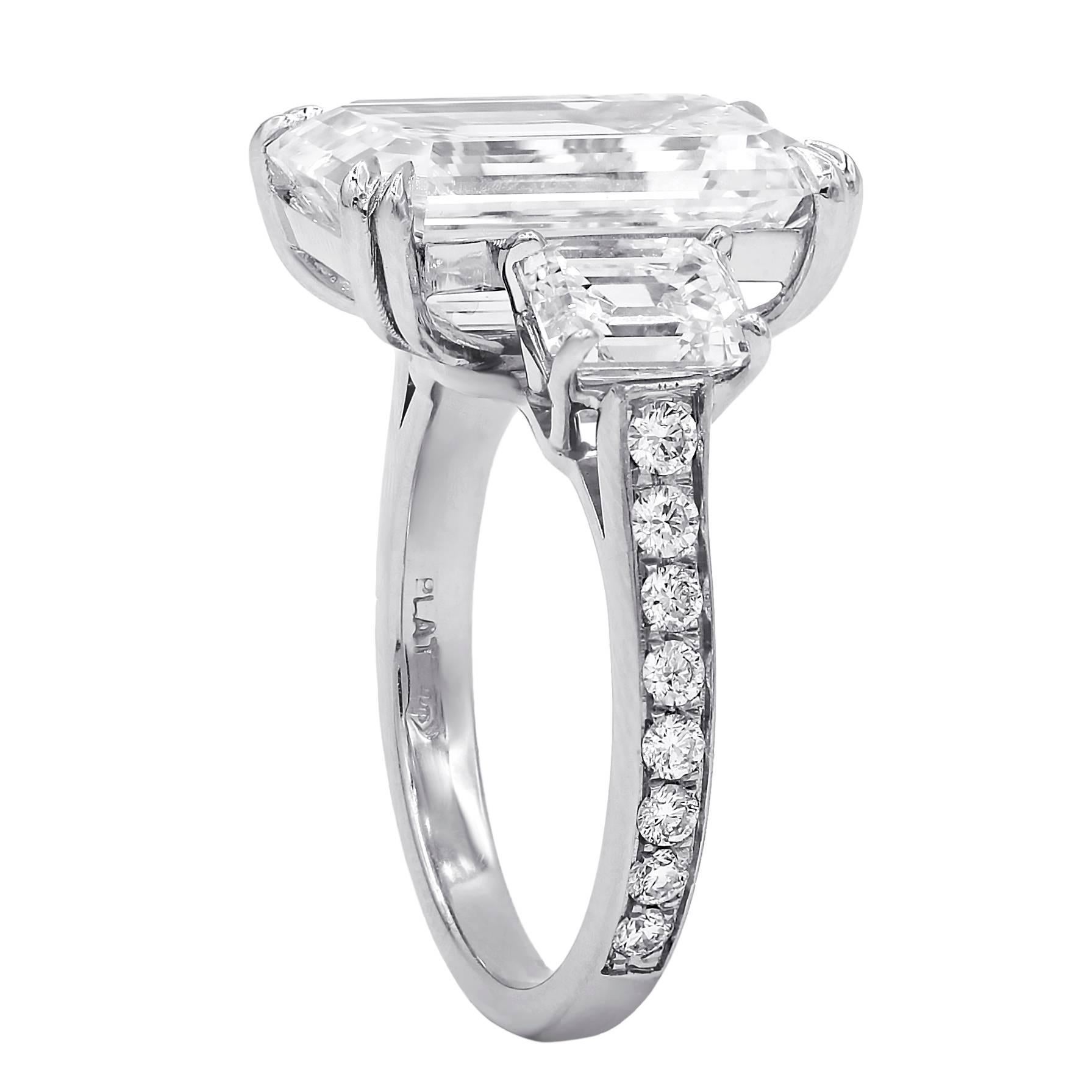 Spectacular Emerald Cut Diamond Ring. The center diamond is 9.38 Carats, The Color grade is I, the Clarity is VVS2. The center stone measures 15.63x10.19x6.32 mm. Accompanied with GIA Certificate.
The center diamond surrounded by Two Emerald cut