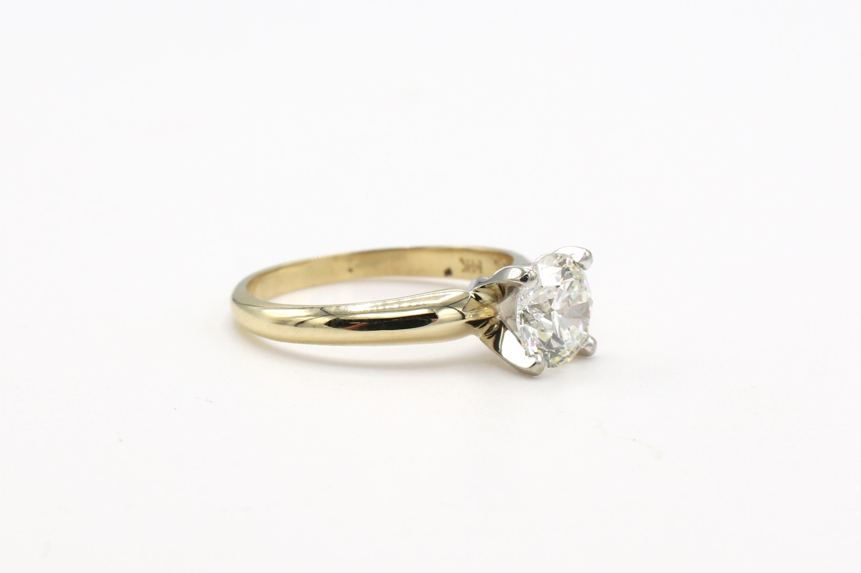 GIA Certified .95 Carat J VS2 Round Diamond Solitaire Engagement Ring 
GIA report number: 6202416911
Diamond: 0.95 carat J VS2 round diamond
Metal: 14k yellow gold, white gold prongs
Size: 4.5 (US)
Band: 1.5 - 2.5mm
