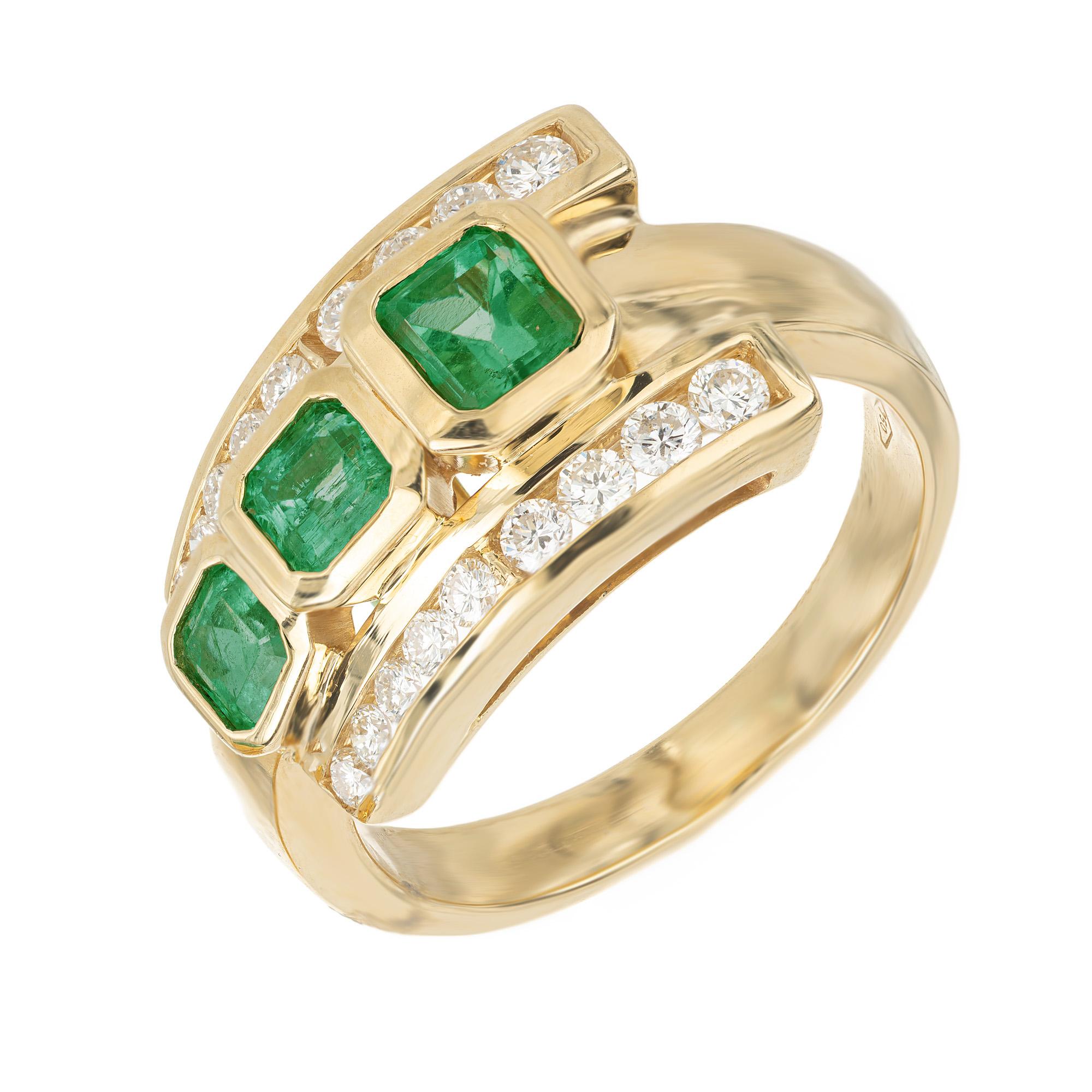 Custom made one of a kind .95 carat emerald and diamond ring, crafted in 18k yellow gold setting. Out of the three glowing natural emeralds, the largest was selected at random by the GIA and was certified as having no oil or clarity enhancement.