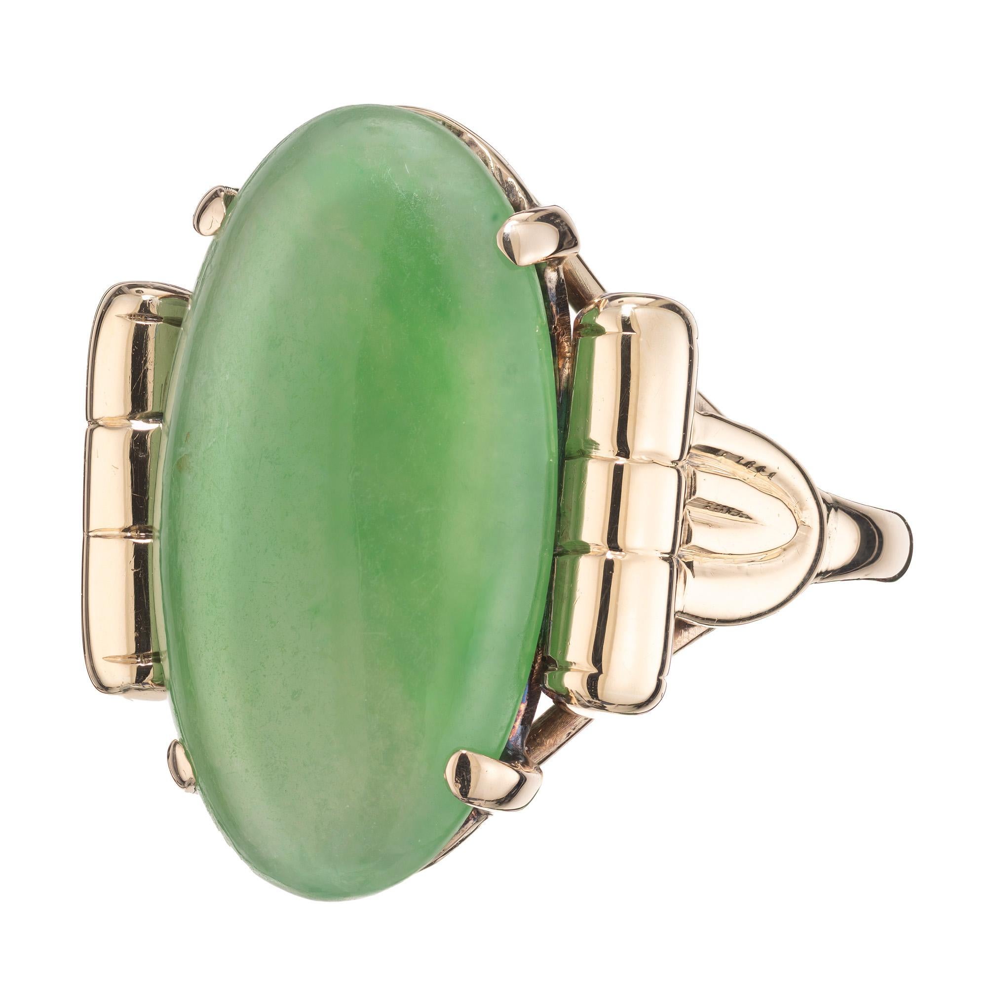 This 1950's mid-century 14k rose gold, GIA certified 9.5 carat single oval cabochon jade ring is a true marvel to behold. The stone is a stunning natural translucent A grade jade in a simple, but detailed mounting that is sure to be a statement