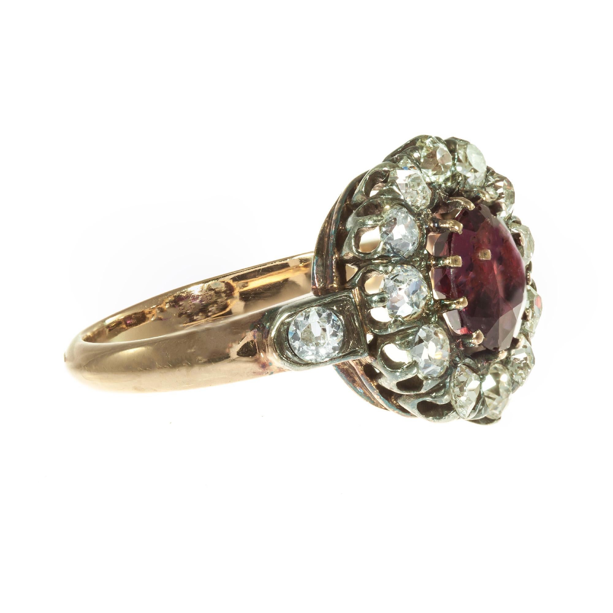 Original red ruby diamond halo engagement ring. Circa 1880-1889 with old mine halo of diamonds surrounding a round brilliant cut ruby. Handmade 14k rose gold setting. 

1 round brilliant cut red MI ruby, Approximate .95ct GIA Certificate #