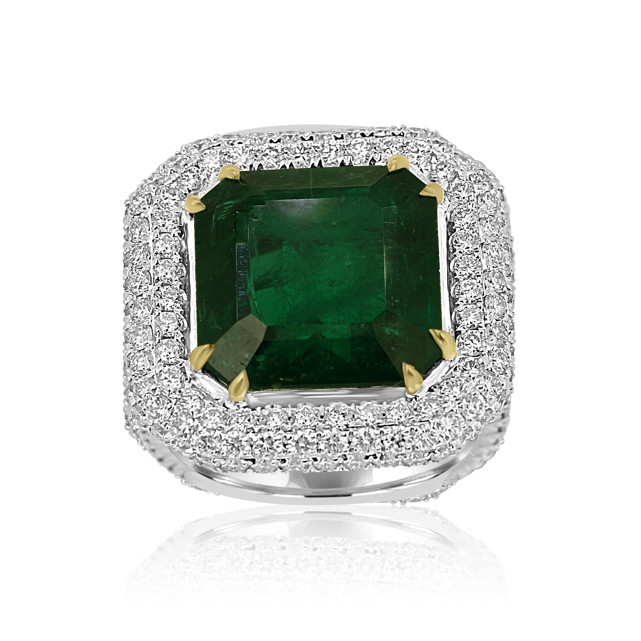 Stunning GIA certified 9.57 Carat Minor Zambian Emerald Cut Emerald encircled in triple Halo of White G-H Color VS-SI diamonds 2.21 Carats in stylish one of a kind handmade 18K White and Yellow Gold Cocktail Statement Ring.

MADE IN USA 
Center