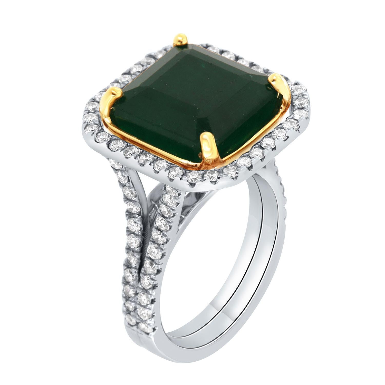 This 18K White and Yellow gold ring feature a 9.61 - Carat Ascher cut Natural Green emerald from Zambia. Excellent deep green color. The emerald is encircled by a halo of brilliant round diamonds on a 4mm wide split shank band. The diamonds are