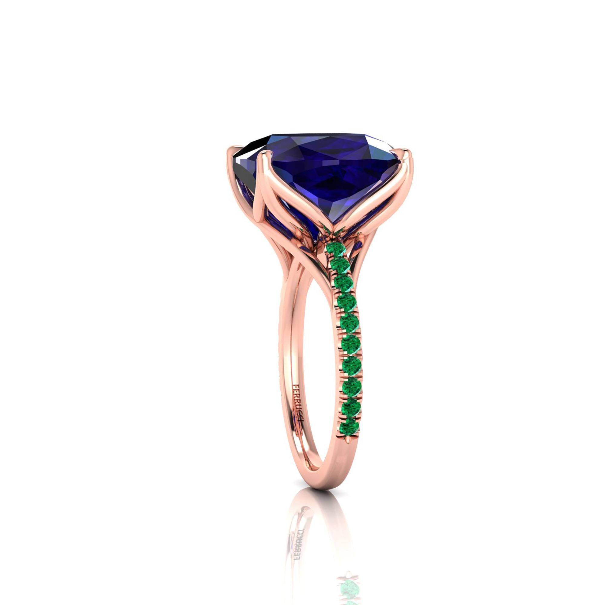 A Spectacular 9.61 carat natural Tanzanite of a deep blue and purple refraction, unique in its splendor, GIA Certified, with green Emerald pave' set on the shoulders of a one of a kind, hand made 18k rose gold ring, designed and conceived in New