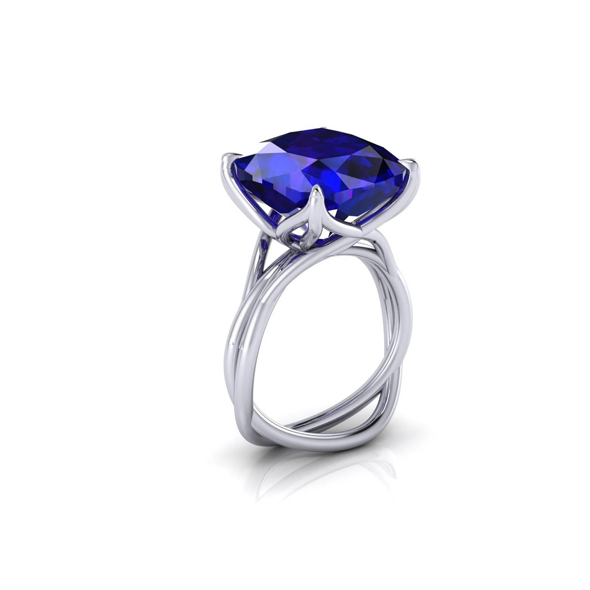 A Spectacular 9.23 carat natural Tanzanite of a deep blue and purple refractions, unique in its splendor, GIA Certified, in a one of a kind, hand made 18k white gold ring, designed and conceived in New York City. A design that recall nature's vines