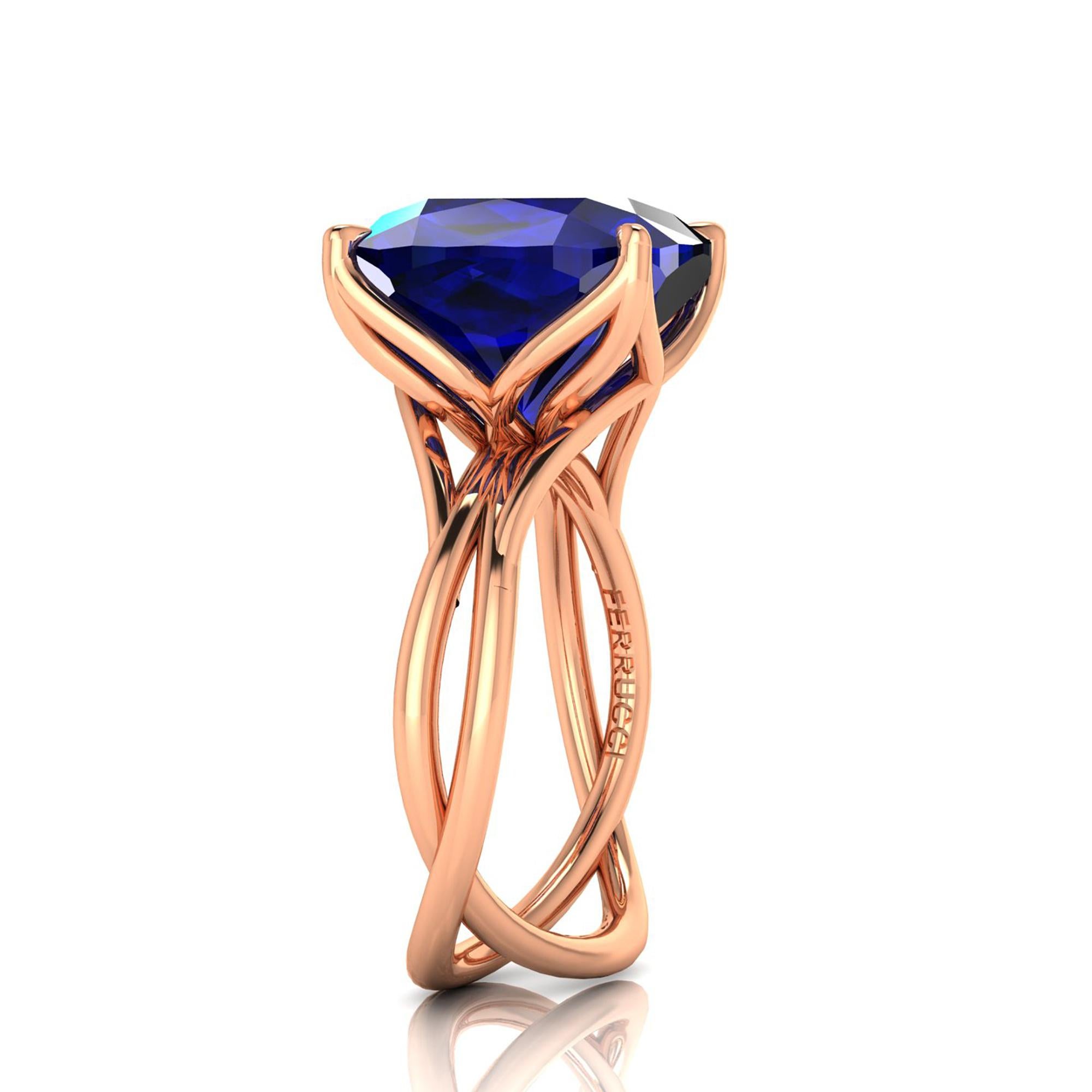 A Spectacular 9.23 carat natural Tanzanite of a deep blue and purple refractions, unique in its splendor, GIA Certified, in a one of a kind, hand made 18k rose gold ring, designed and conceived in New York City. A design that recall nature's vines