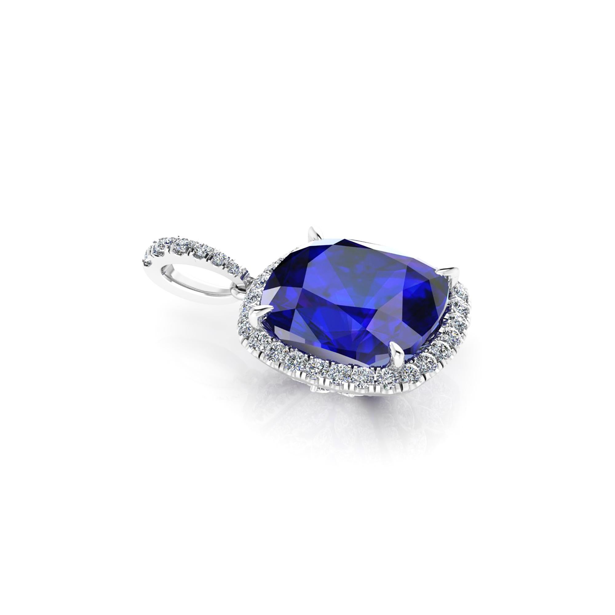  GiA Certified 9.23 carat natural Tanzanite of a deep blue and purple refraction, with a halo of white round and marquise diamonds set everywhere under the basket and on the bail, for an approximate total diamond weight of 1.35 carats, Platinum 950