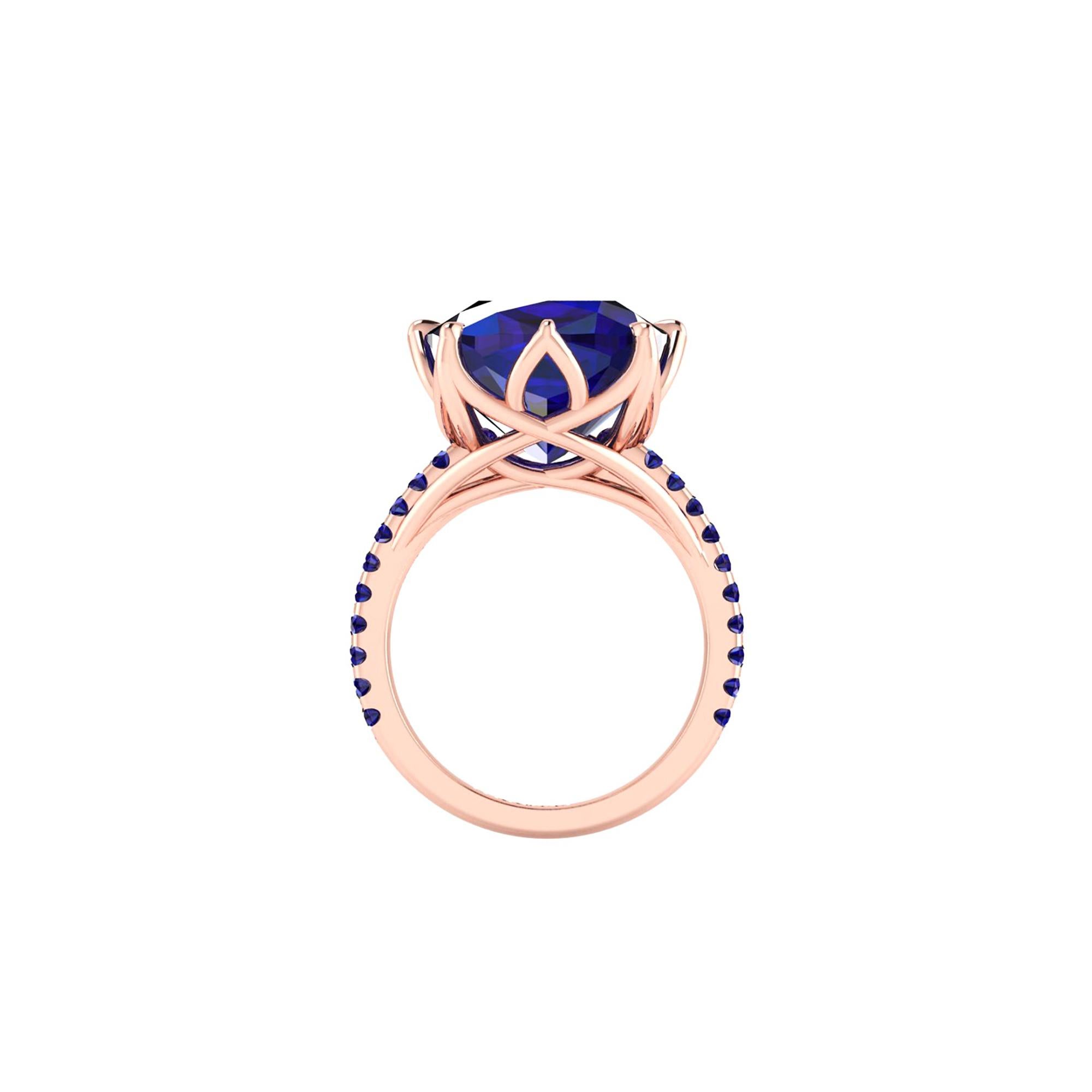 9.23 carat Tanzanite cushion cut GIA Certified, with blue sapphires pave' set on the shoulders of a one of a kind, hand made 18k rose gold ring, designed and conceived in New York City. A design that recall nature's vines and ever flowing life of